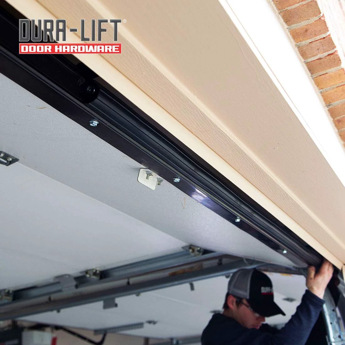 Close-up of Premium EPDM Rubber Weather Seal For 8 Foot Wide Garage Doors installed at the top of a garage door.