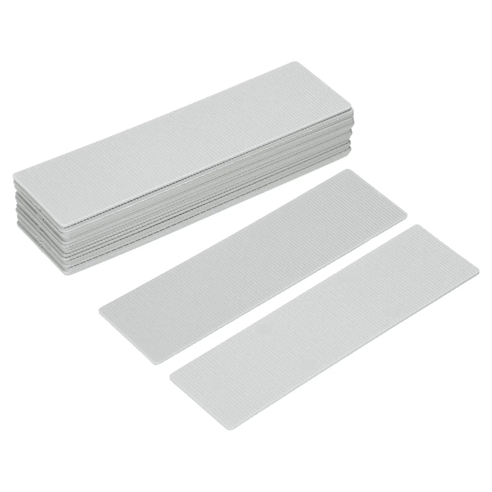 Stack of grey Twenty Pcs Plastic Flat Shims for Leveling One Millimeter One Thirty Second Inch Structural Tile Composite Shims