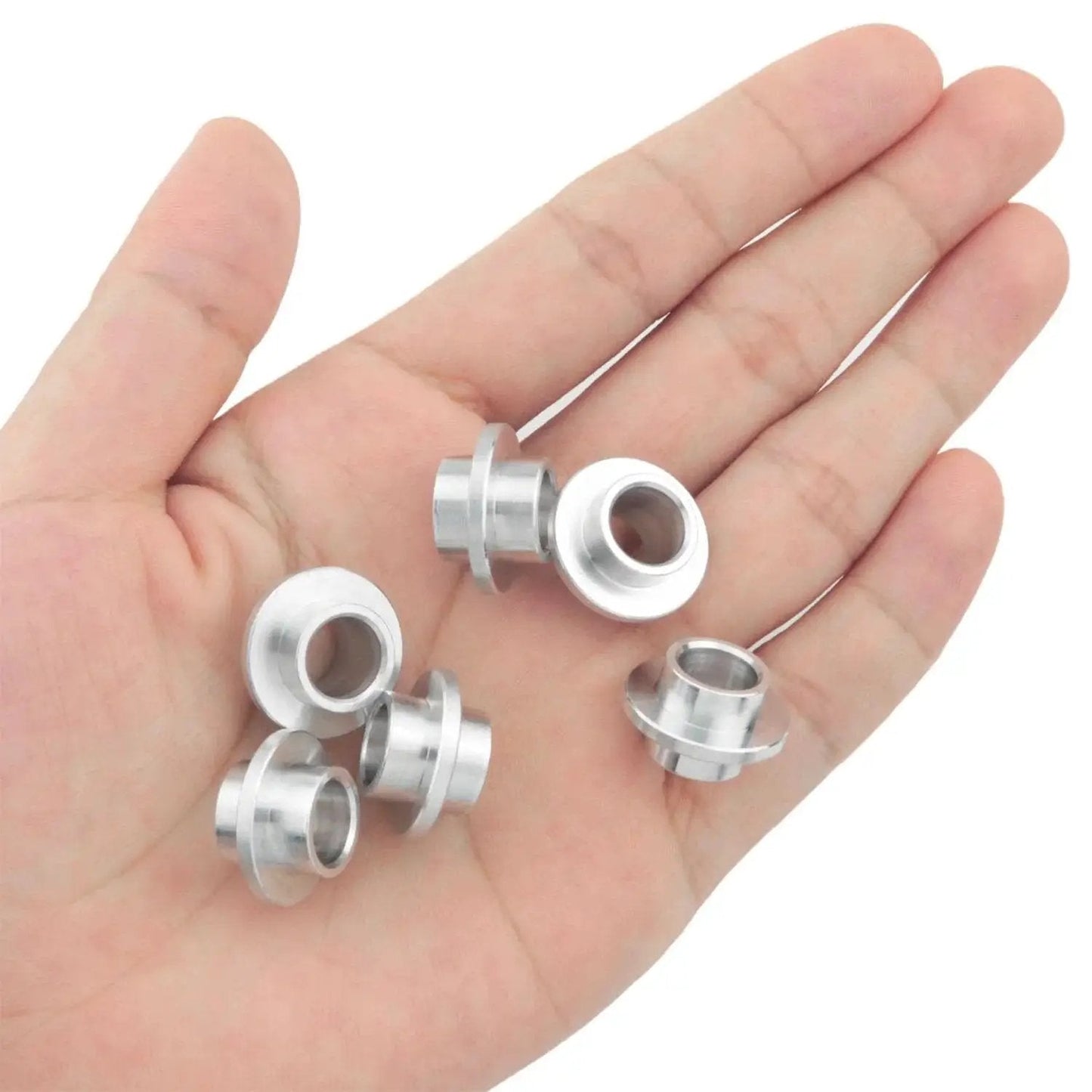 Aluminum Inline Skate Bearing Bushing Spacers Kit 16 Pieces With 8mm Axle Spacers shown in hand for size reference.