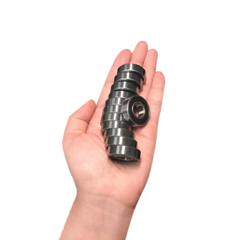 R8 2RS Ball Bearings 12 Pack For Miniature Projects And Small Motors Double Rubber Sealed Deep Groove Bearings in hand
