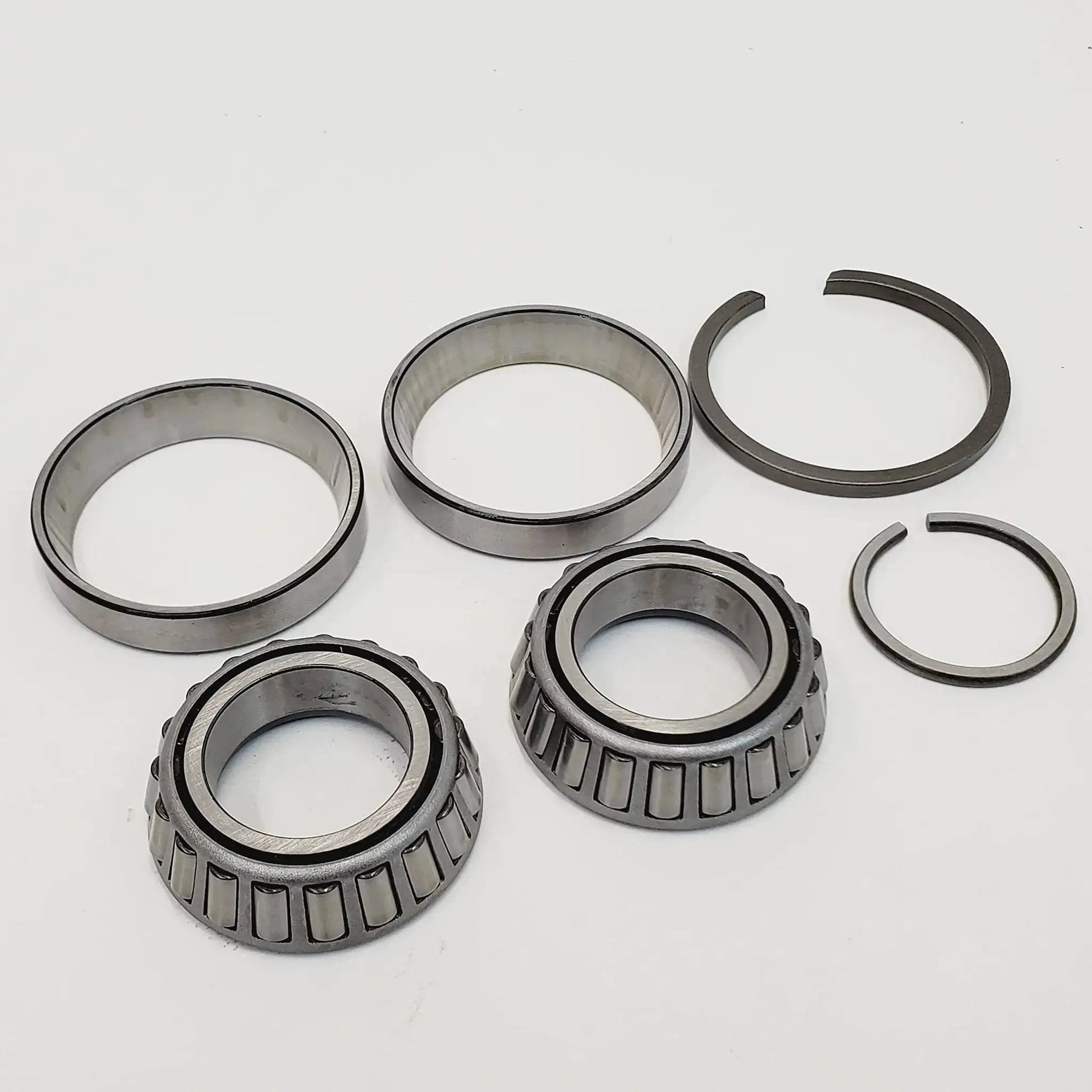 Left Side Crankcase Main Bearings With Races And Spacers For Harley Shovelhead 1969 To 1984 Evolution 1984 To 1999 And Twin Cam 1999 To 2002 Big Twin Engines Replaces HD 9028 Made In USA, showing full set of components on white background.