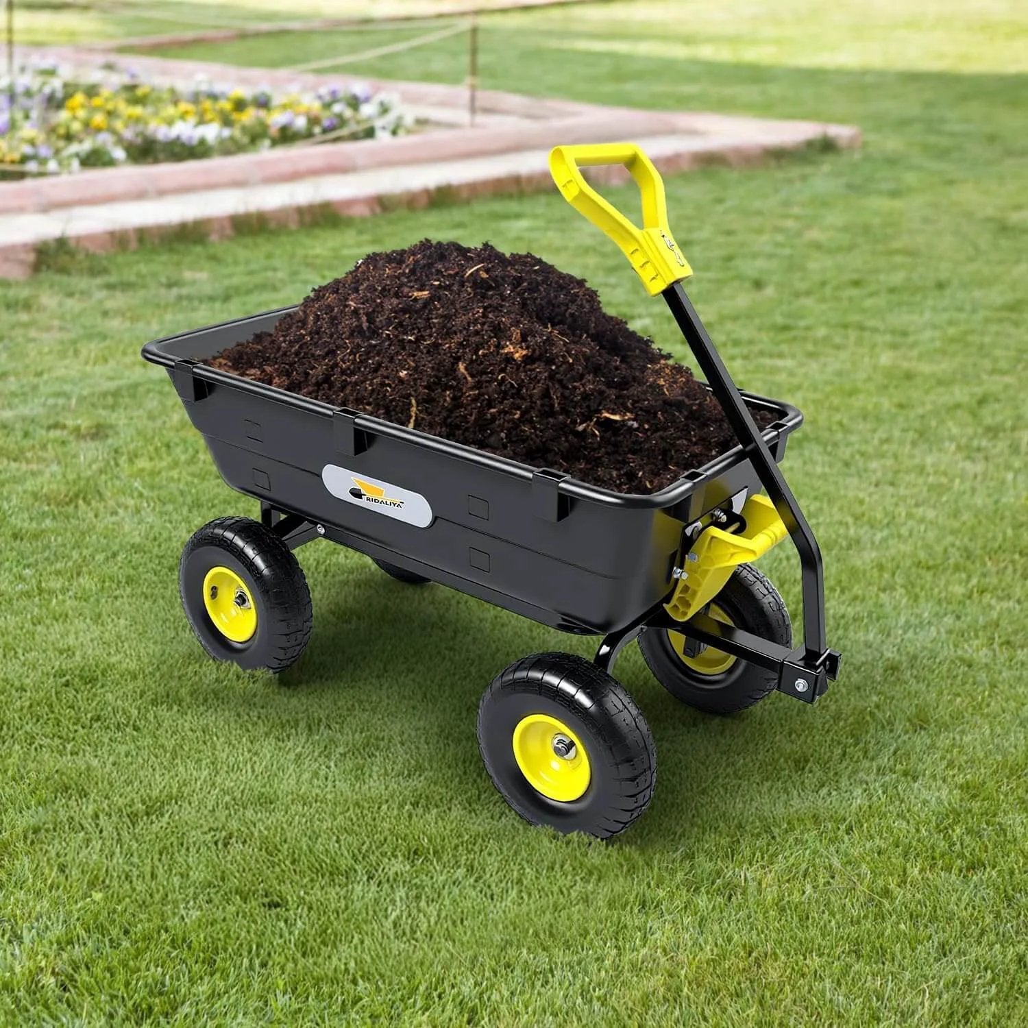 Heavy Duty Garden Dump Cart Utility Wagon with 900 LB Capacity 5 Cu Ft Bed and 10 Inch Pneumatic Tires filled with soil on grass