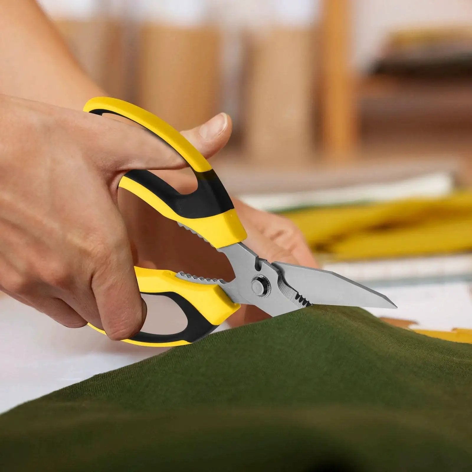 Person using Heavy Duty 8 Inch Utility Scissors With Serrated Blades for cutting fabric in a craft setting