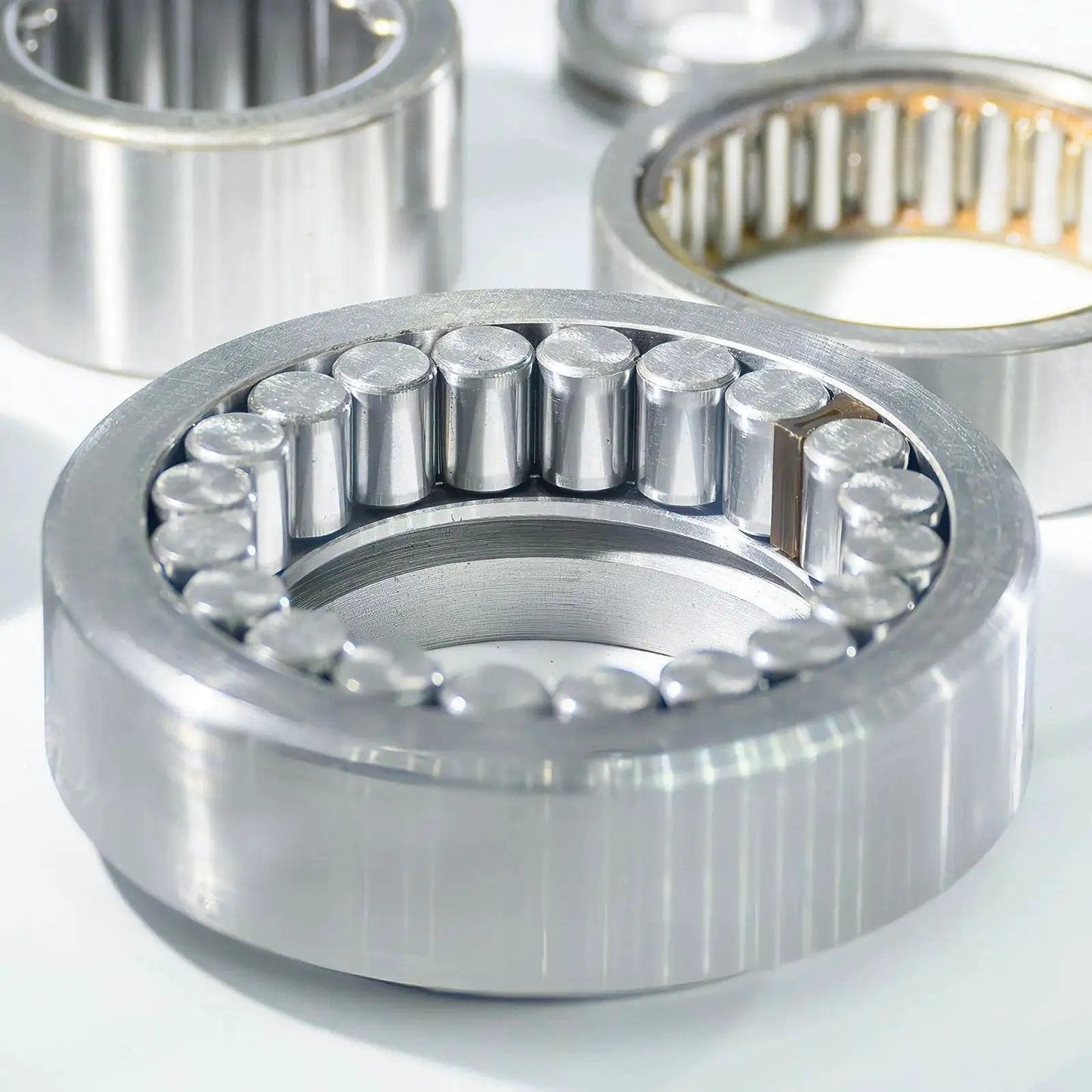 Silver tone cylindrical steel dowel pins for shelf support, shown close-up in bearing context, Heavy Duty 100 Piece 3mm By 11mm Steel Dowel Pins Set For Shelf Support And Cabinet Hardware Cylindrical Pins With Silver Tone Finish Built To Last And High Precision Plus Or Minus 0.02mm Tolerance 58 62 HRC