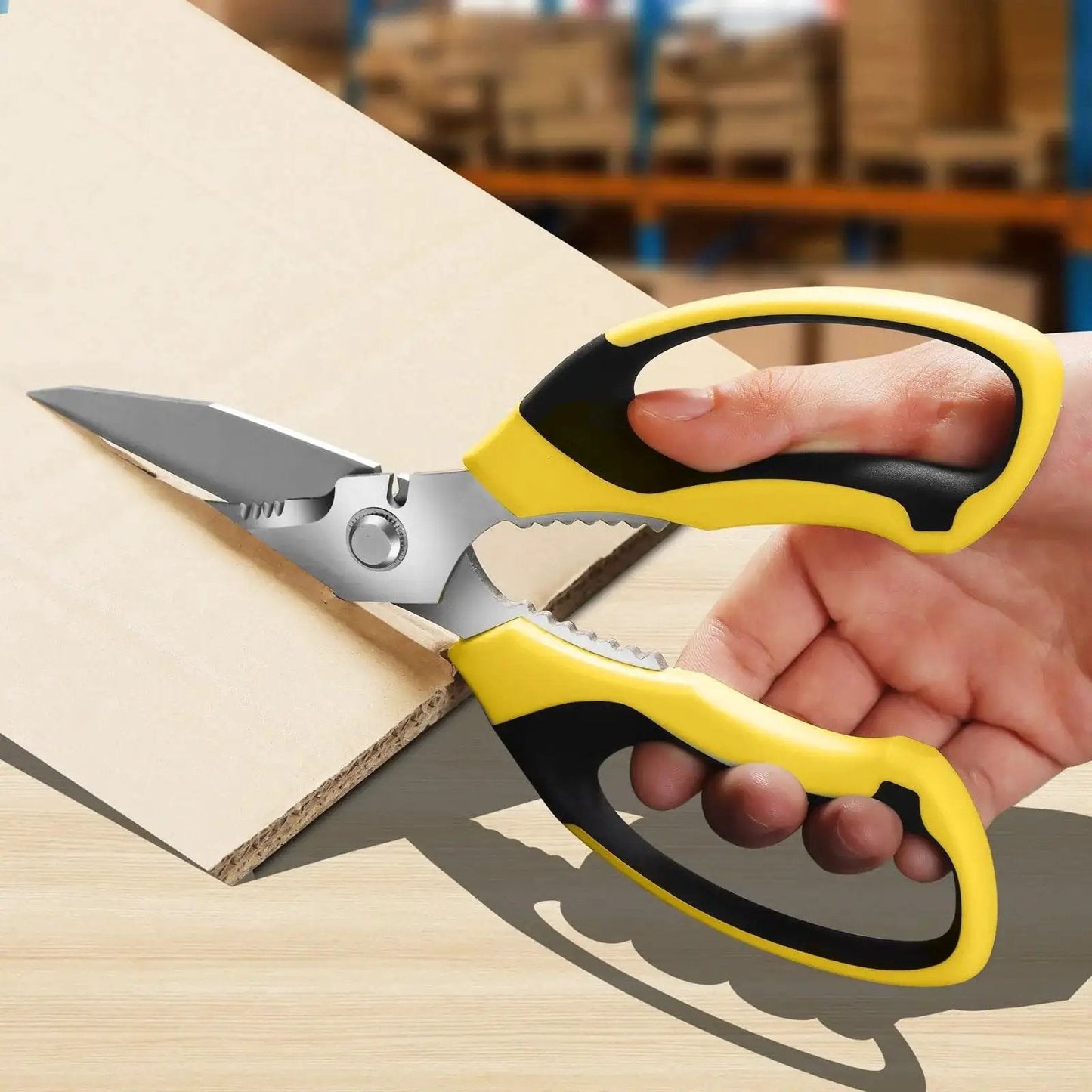 Heavy Duty 8 Inch Utility Scissors With Serrated Blades cutting cardboard, ergonomic yellow and black grip, close-up view