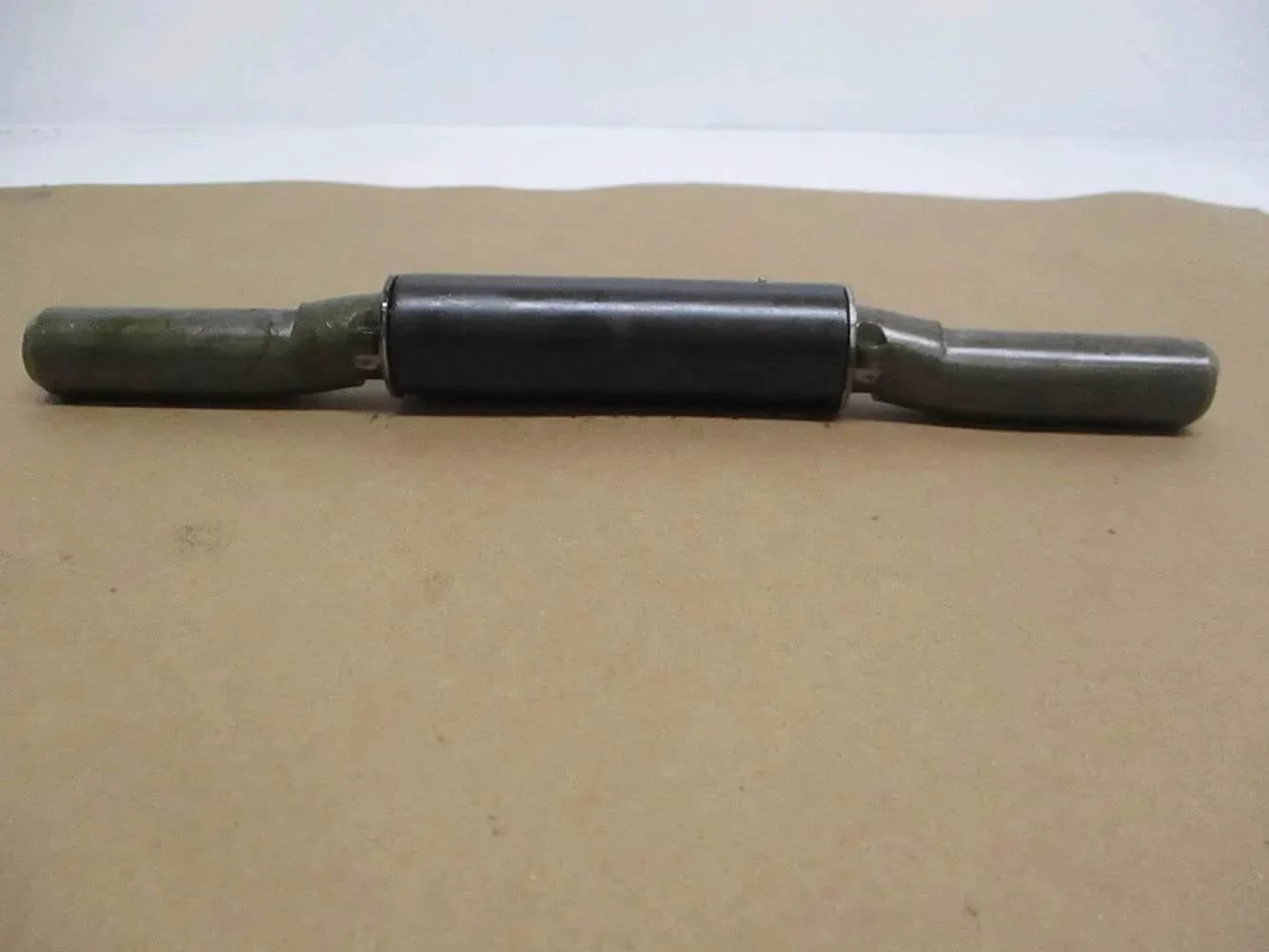 One of the (4) weld on trailer ramp door hinges 1 inch by 10 inch 9 gauge raw steel with integrated grease fitting heavy duty