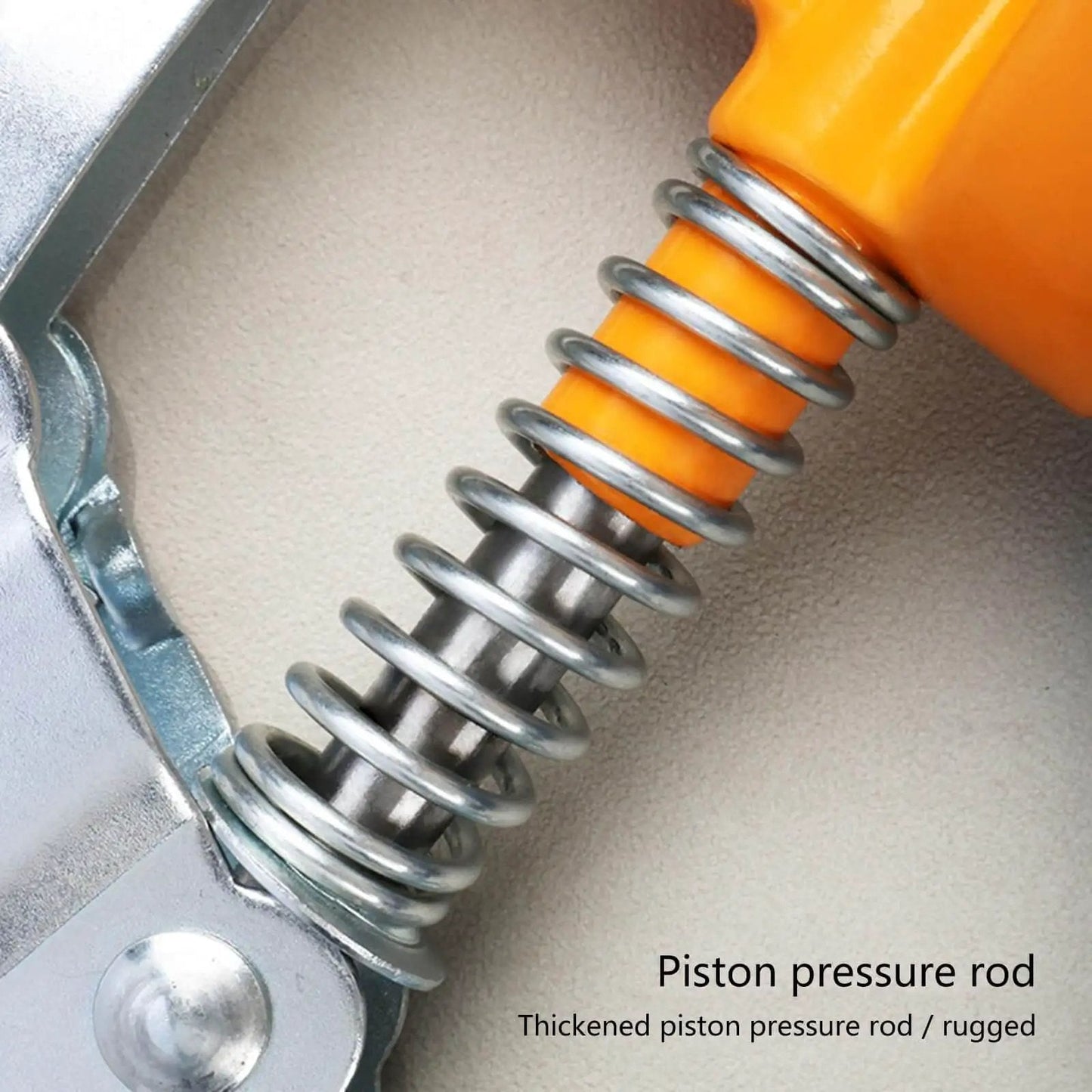 Close-up of piston pressure rod on One Handed 120cc High Pressure Grease Gun for Precise Lubrication, bright yellow handle visible.