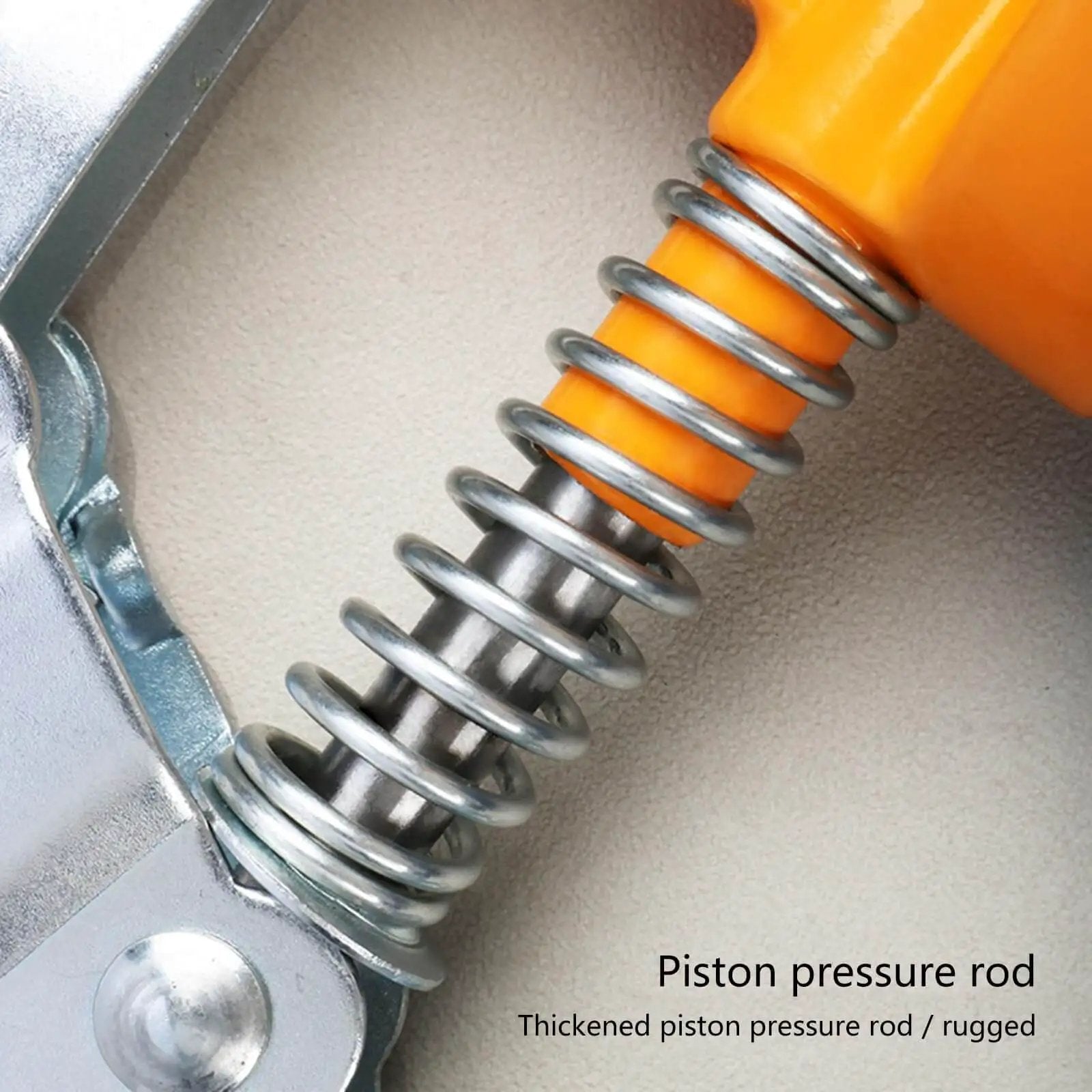Close-up of piston pressure rod on One Handed 120cc High Pressure Grease Gun for Precise Lubrication, bright yellow handle visible.