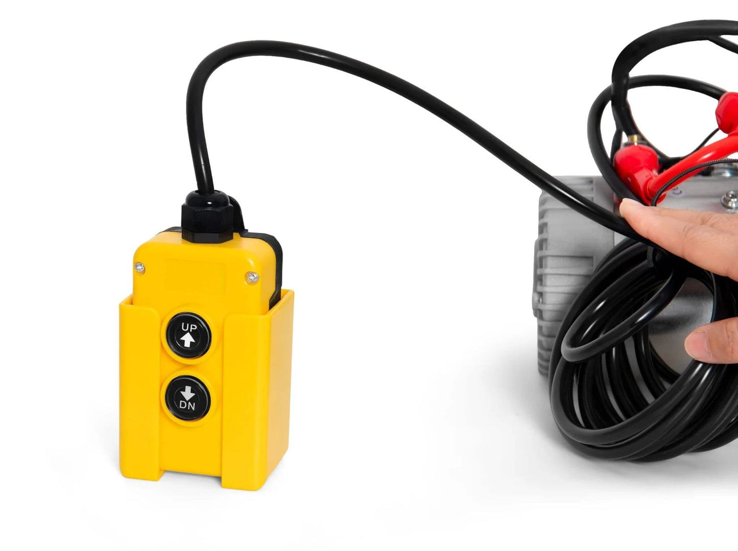 Close-up of a yellow control switch connected to a Hydraulic Pump 12V Dump Trailer Pump - Hydraulic Power Unit Double Acting Electric Hydraulic Pump
