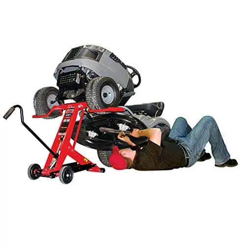 Heavy Duty Hydraulic Lift Jack For Zero Turn Radius Riding Mowers With 500 Pound Lift Locks Bar For Safer Deck Access Ideal For Front End Maintenance And Cleaning Compatible With EGO And Leading ZTR Mower Brands, side view of mower lifted with person working underneath