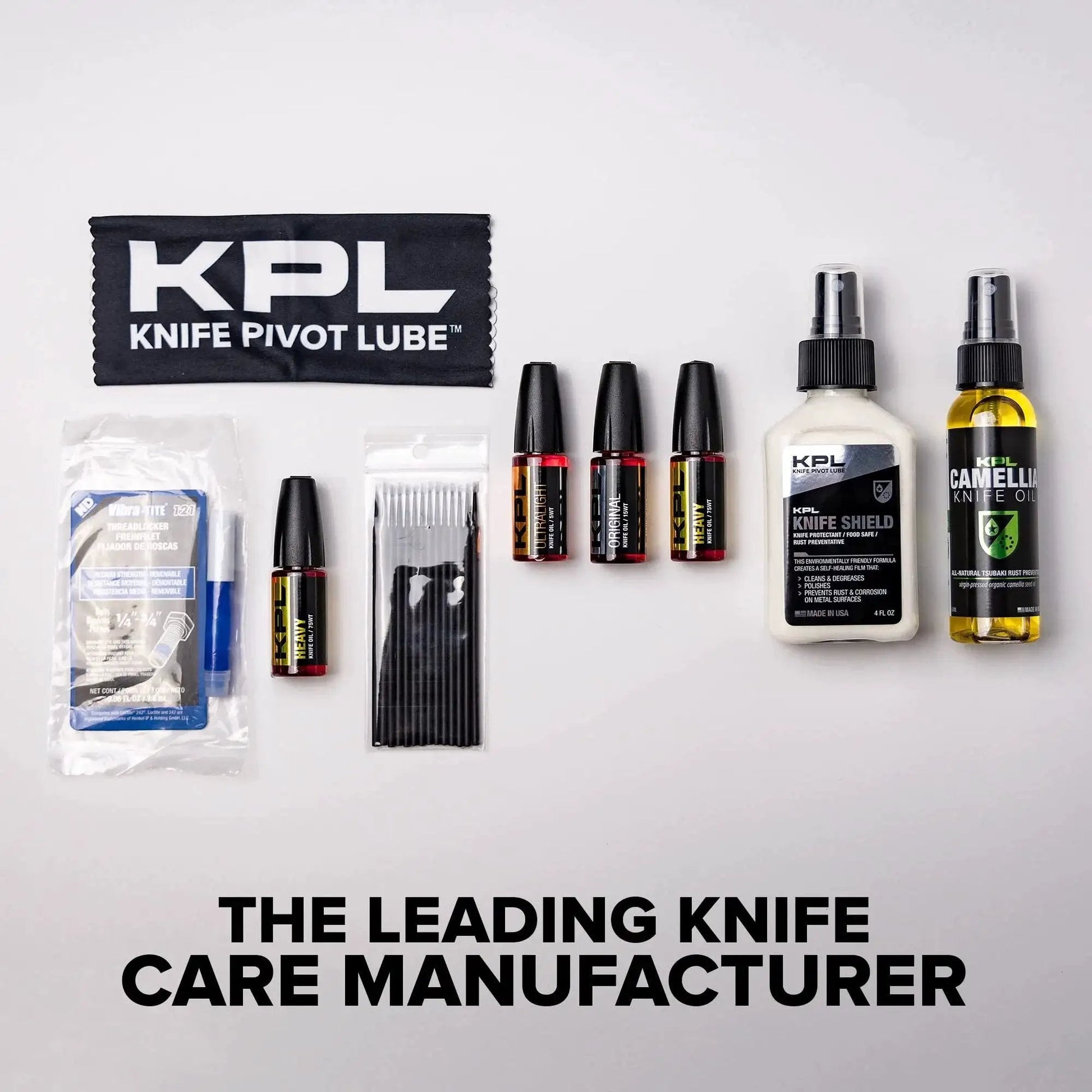 Assorted knife care products including heavy duty knife pivot lube, oils, and cleaning supplies displayed on a white background.