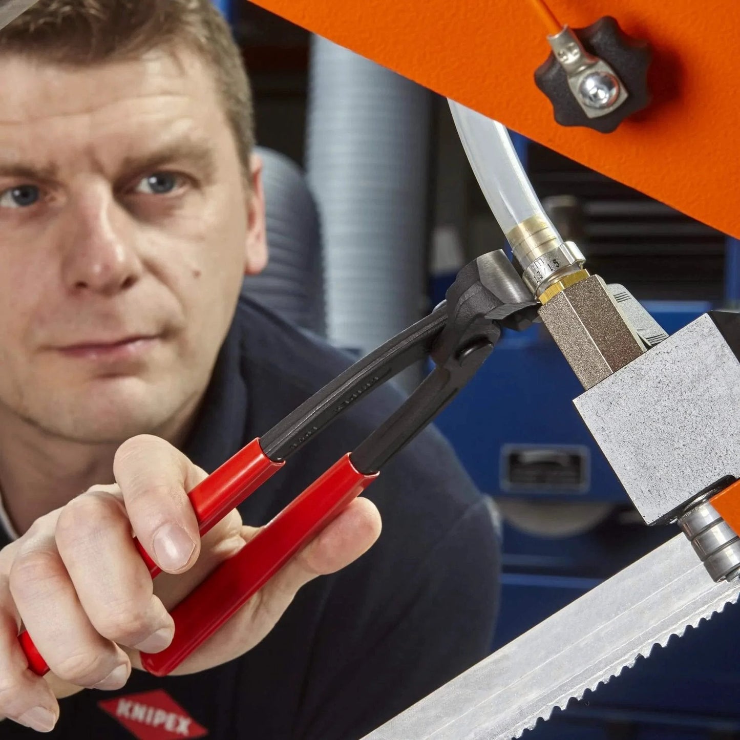 Person using Knipex Tools Eight Point Seven Five Inch Ear Clamp Pliers 1 Ear 2 Ear Clamp Tool 1098i220 on metal fitting