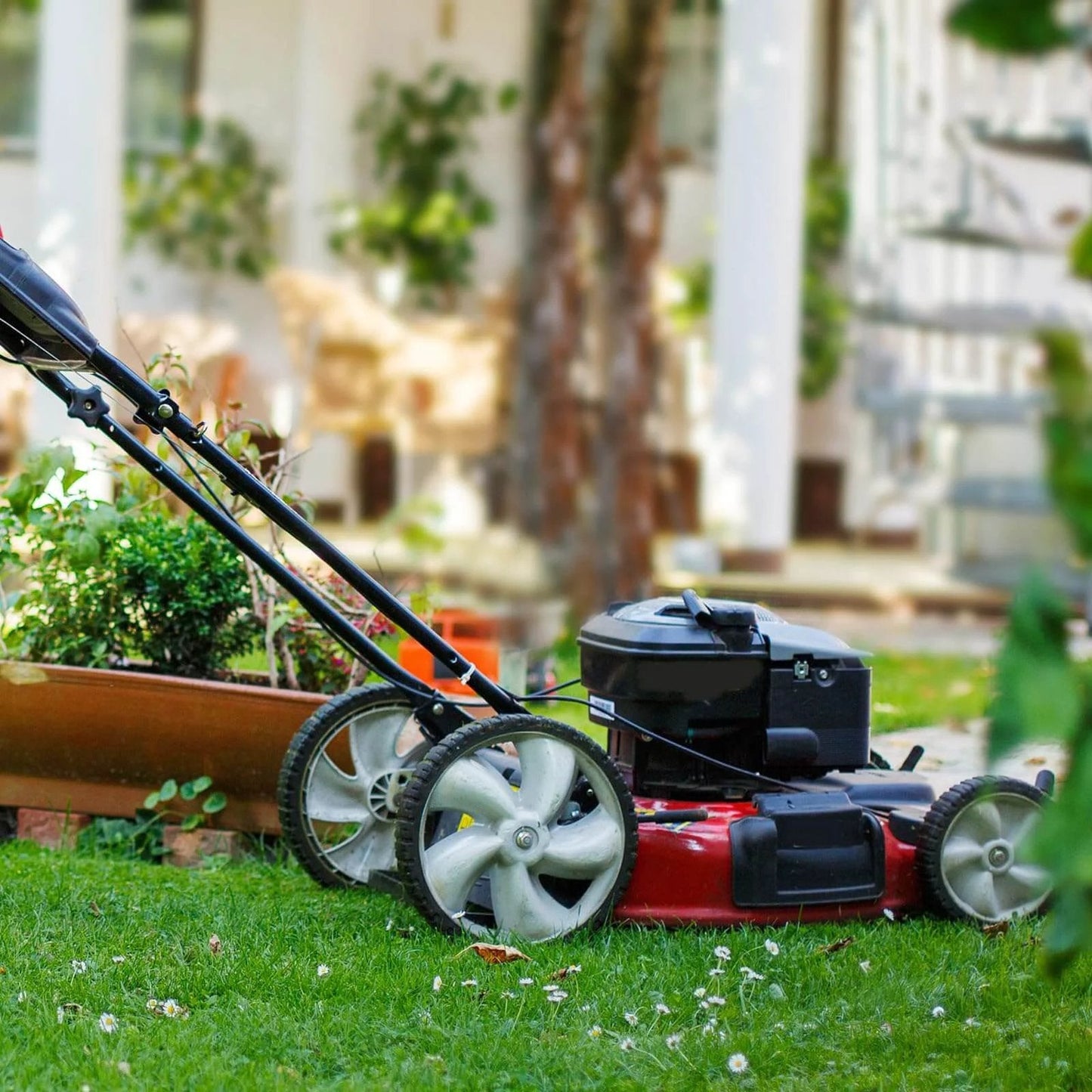 Lawn mower fitted with 12 Inch Rear Lawn Mower Wheels Replacement for Arnold 490-324-0002, 12x1.75 plastic wheels in a garden