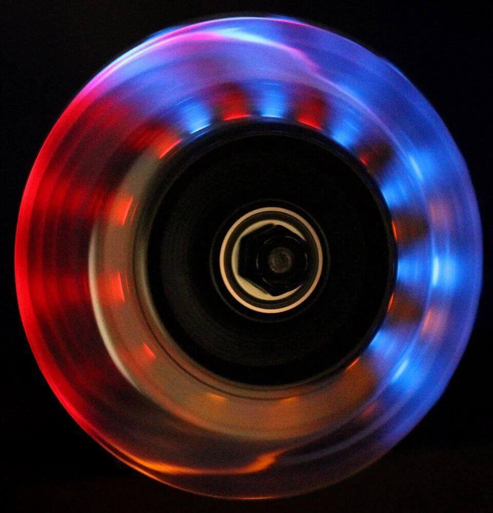 L.E.D. Scooter Wheels with Bearings for Scooters 100mm Light Up 2-Pack (Black) showing colorful LED lights in motion