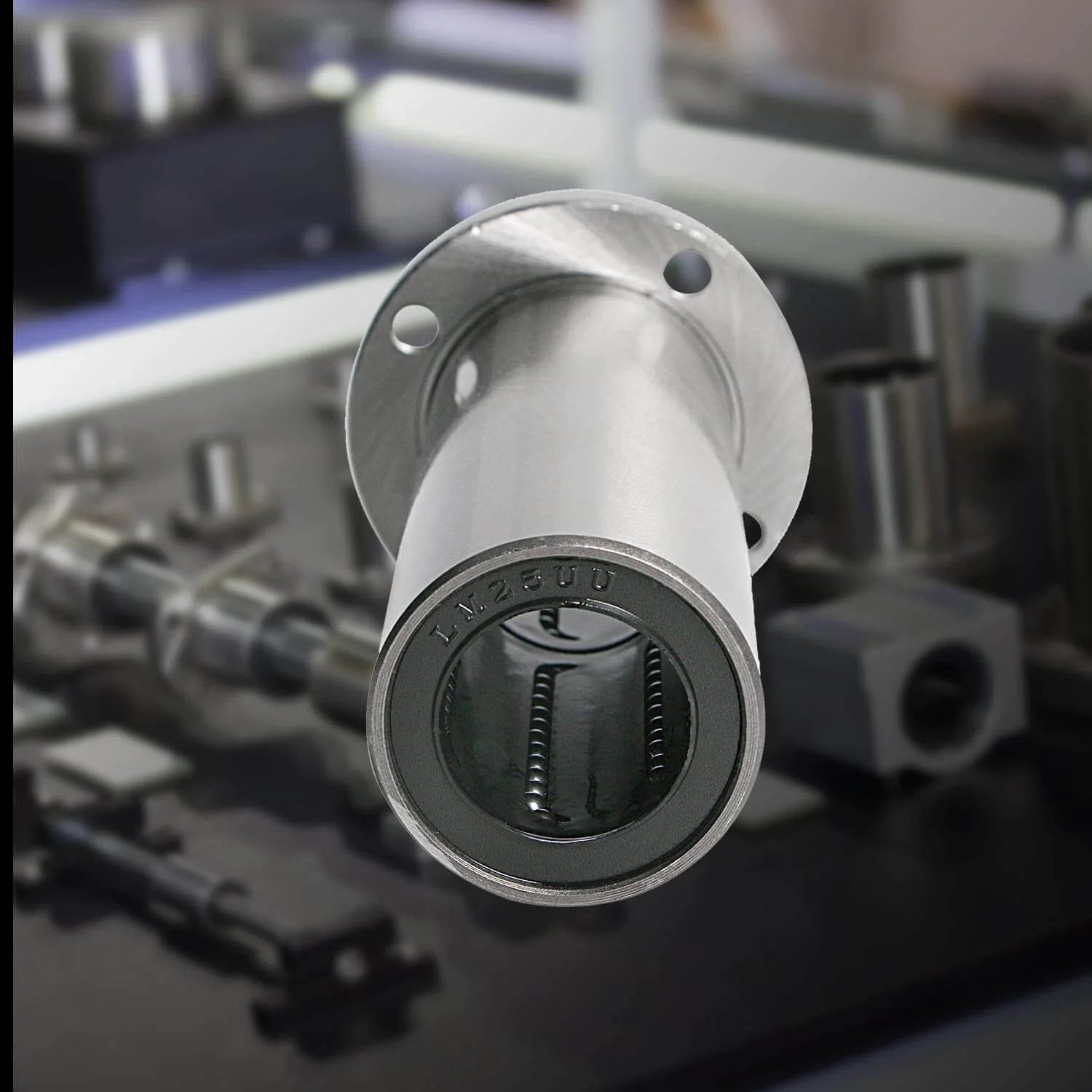 Close-up of Lmf25luu linear ball bearing round flange, ID 25mm, OD 40mm, sae52100 carbon steel, 6 rows of steel balls