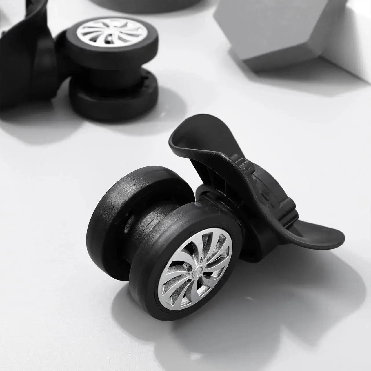 Close-up of 4 Piece Universal Luggage Wheels Replacement Kit For Suitcases, 360 Degree Silent Swivel Casters with silver accents.