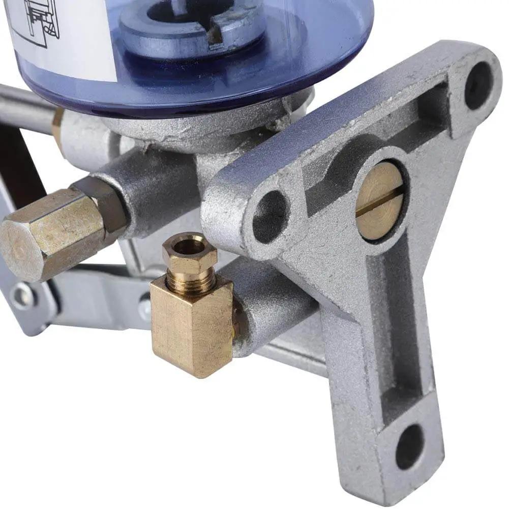 Close-up of Manual Grease Pump LSG05 Hand Operated Lubricator, aluminum alloy with 6mm outlet fitting, partial view
