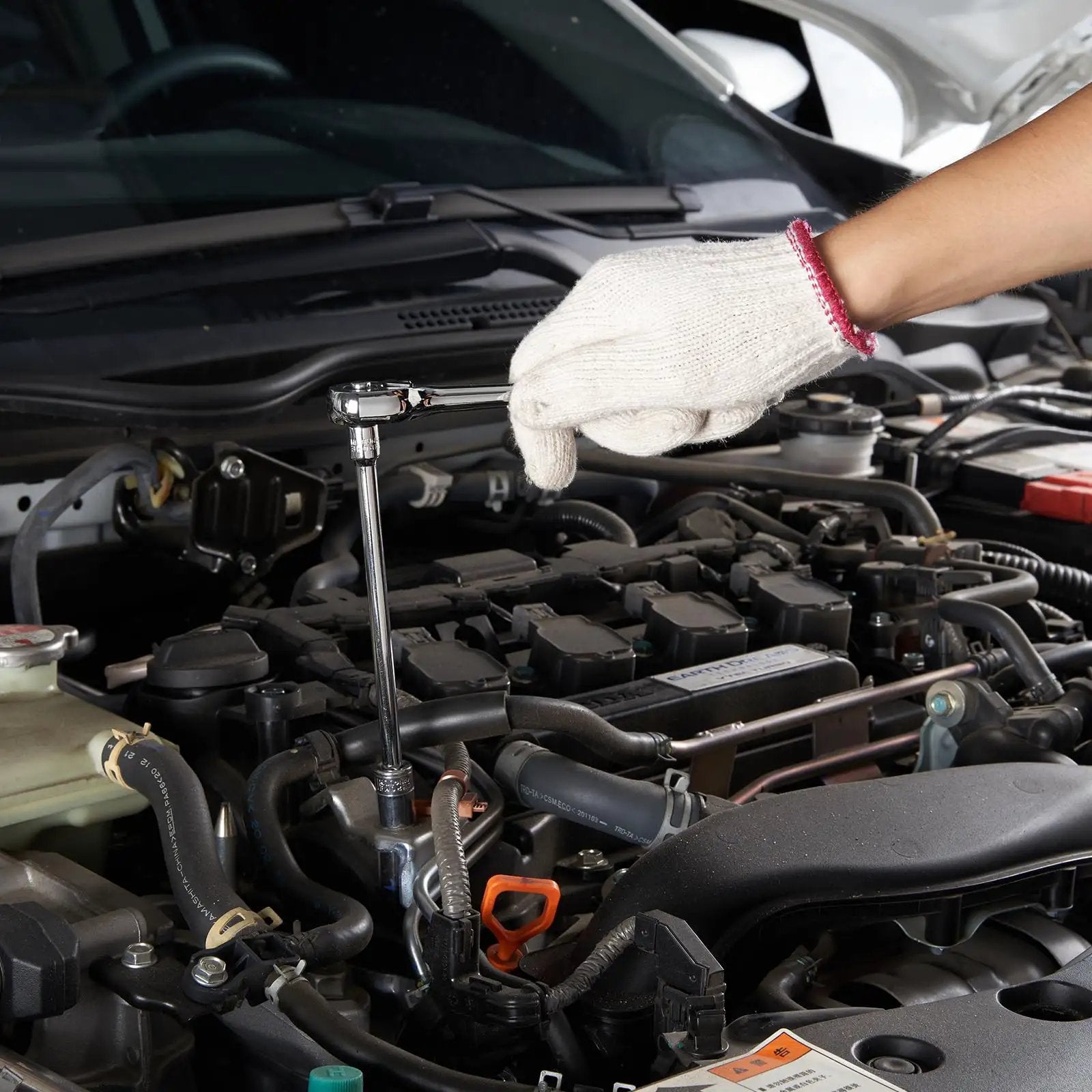 Mechanic using Premium Mechanics Tool Set With Deep And Standard Sockets In One Quarter Inch Drive, Three Eighths Inch Drive, And One Half Inch Drives, 450 Piece SAE And Metric Kit in car engine