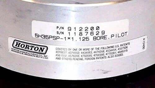 Close-up of label on Nexen Horton 912200 Tooth Clutch 5H35Psp-1 1.125 Bore showing part number and serial number.