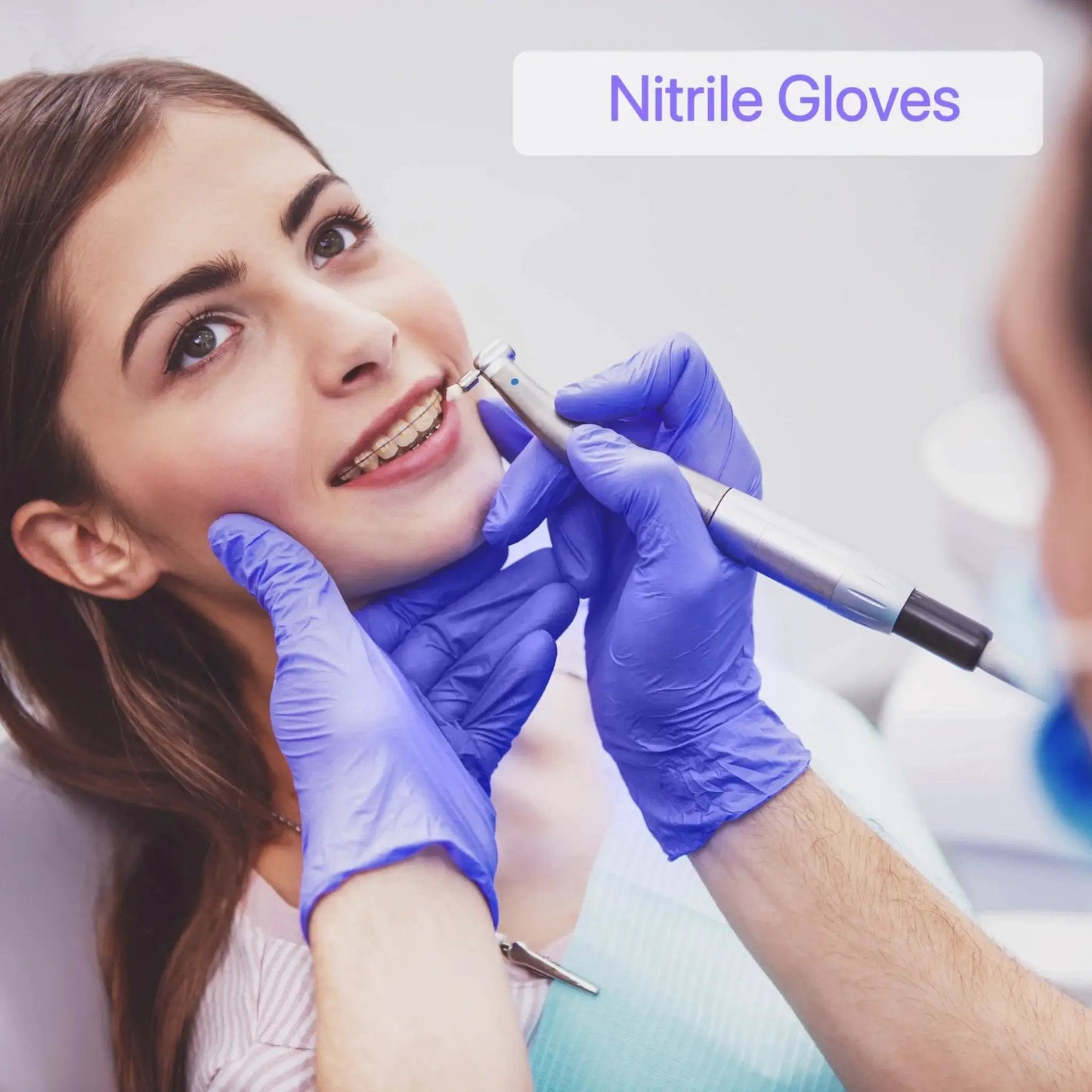 Dentist wearing Nitrile Gloves Powder Free Latex Free 4 Mil Ultra Strong Large 100 Count working on patient