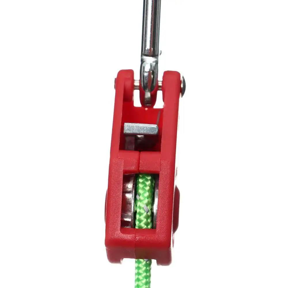 Close-up of stainless steel nylon adjustable rope fastener with fixed buckle and pulley for awning wind ropes and tent ropes.