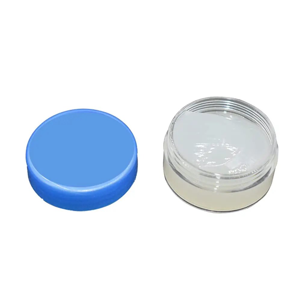 Open jar of White Lithium Grease for Machinery and Gears, High and Low Temperature Resistance, beside a blue lid.