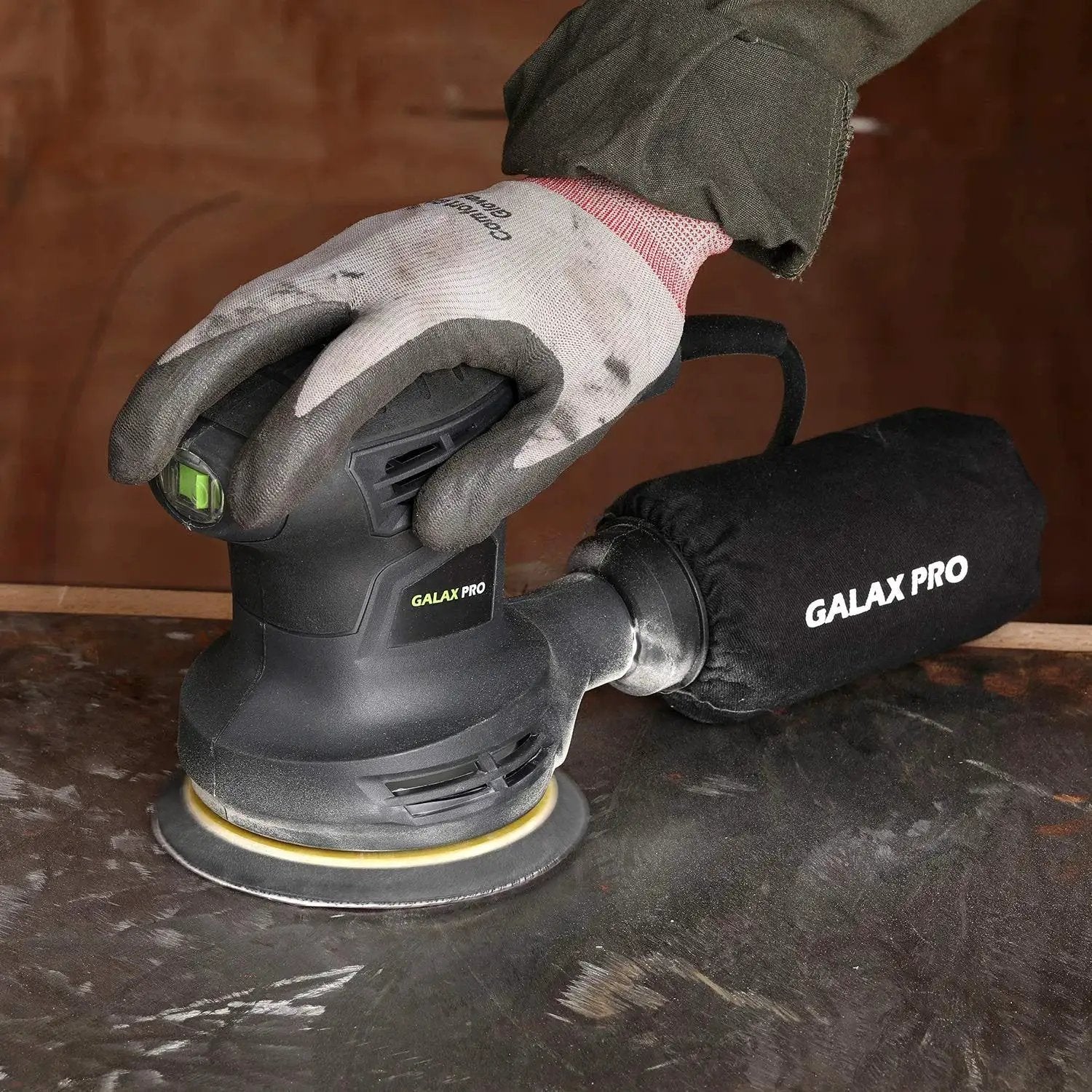 280W Orbital Sander 13000 RPM With Dust Collection And 15 Discs in use on a metal surface, attached dust bag visible