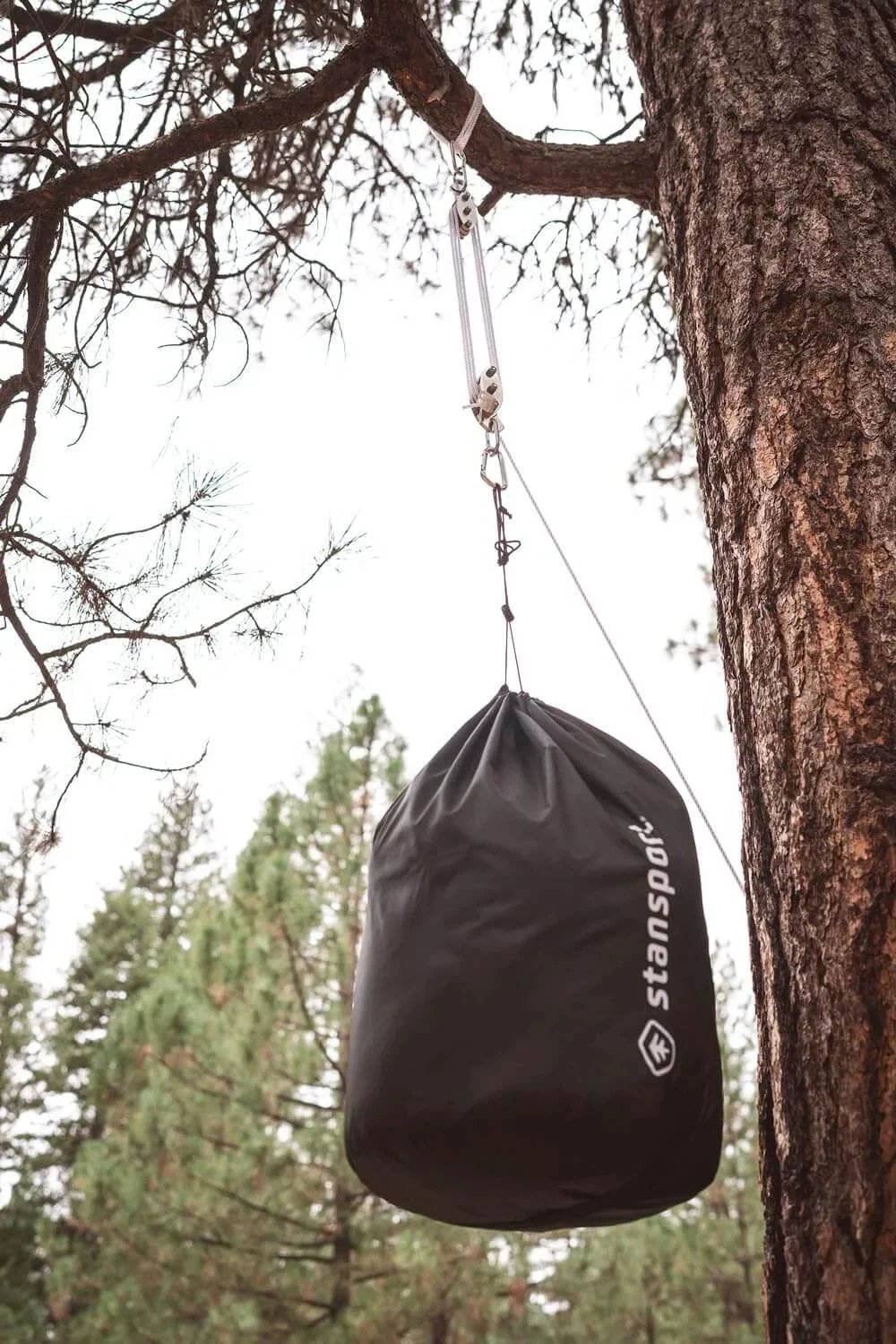 Heavy Duty Indoor Outdoor Pulley Hoist With Chromed Pulleys Polypropylene Rope 440 Lb Capacity 65 Ft installed on tree lifting bag