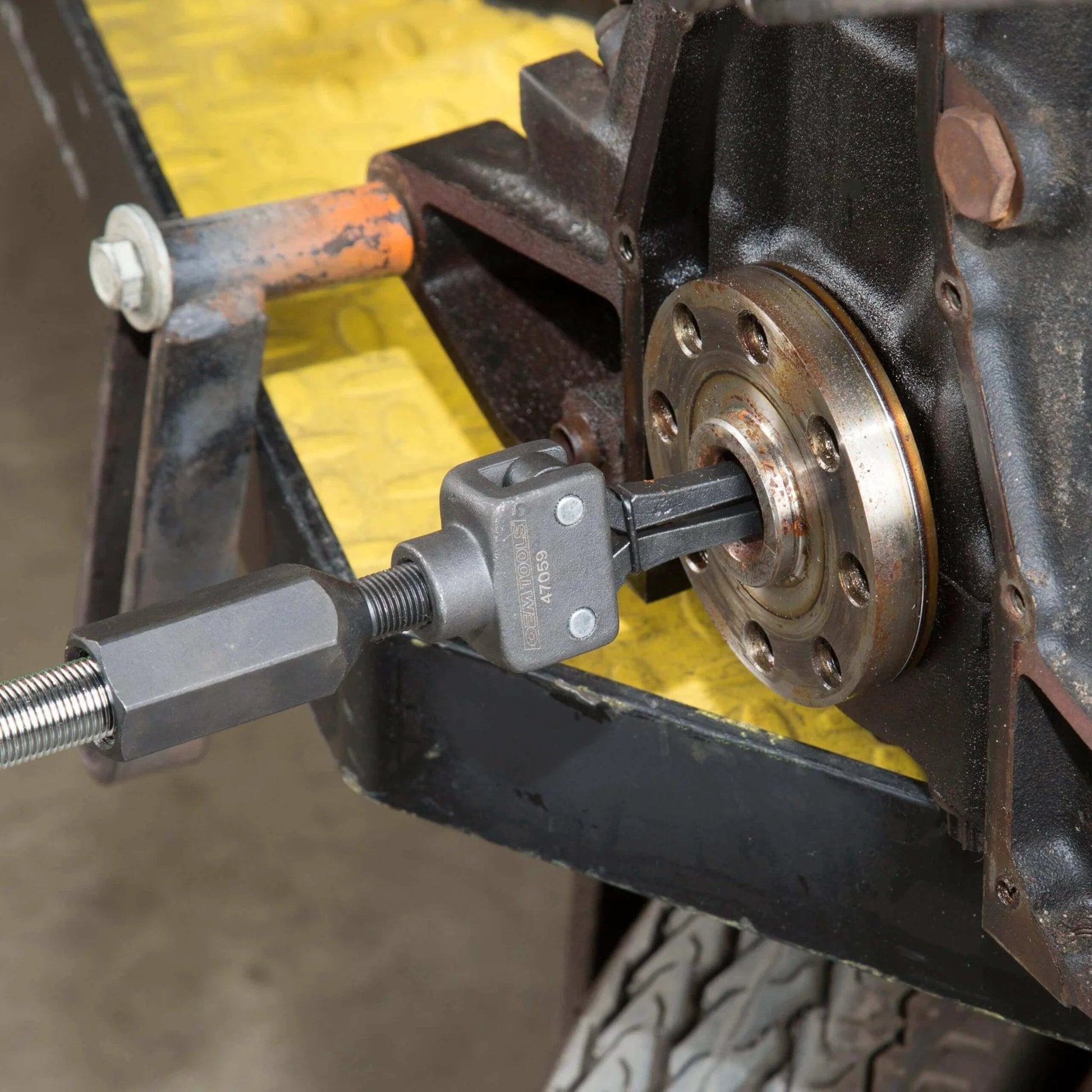 Pilot Bearing Puller Attachment For Slide Hammer installed, 2-Jaw Puller Pilot Bearing Removal Tool on machinery hub, side view