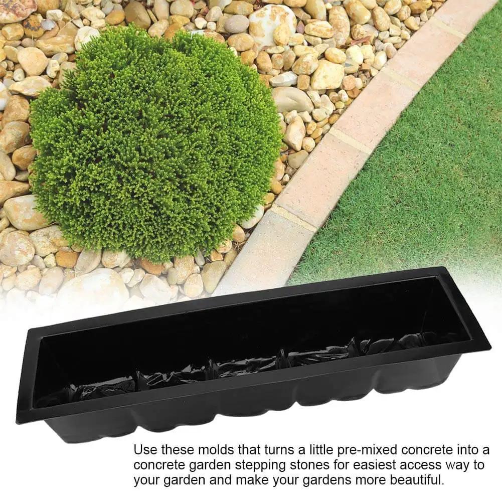 2 Pack Reusable Plastic Stepping Stone Molds For DIY Concrete Paths And Garden Walkways, laying on gravel near greenery