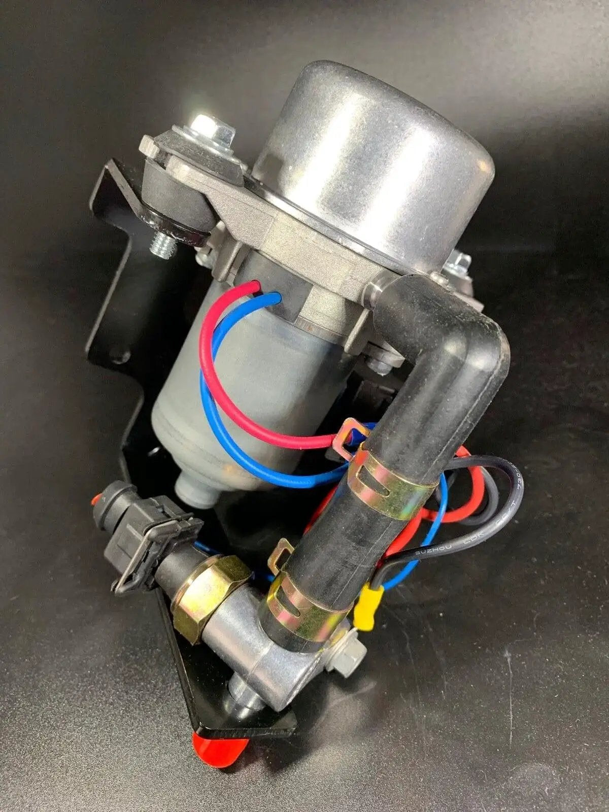 Ultra Quiet Rotary Vane Vacuum Pump For Brake Boosters Delivers Up To 28 Inches Of Vacuum In Seconds, shown with wiring and mount
