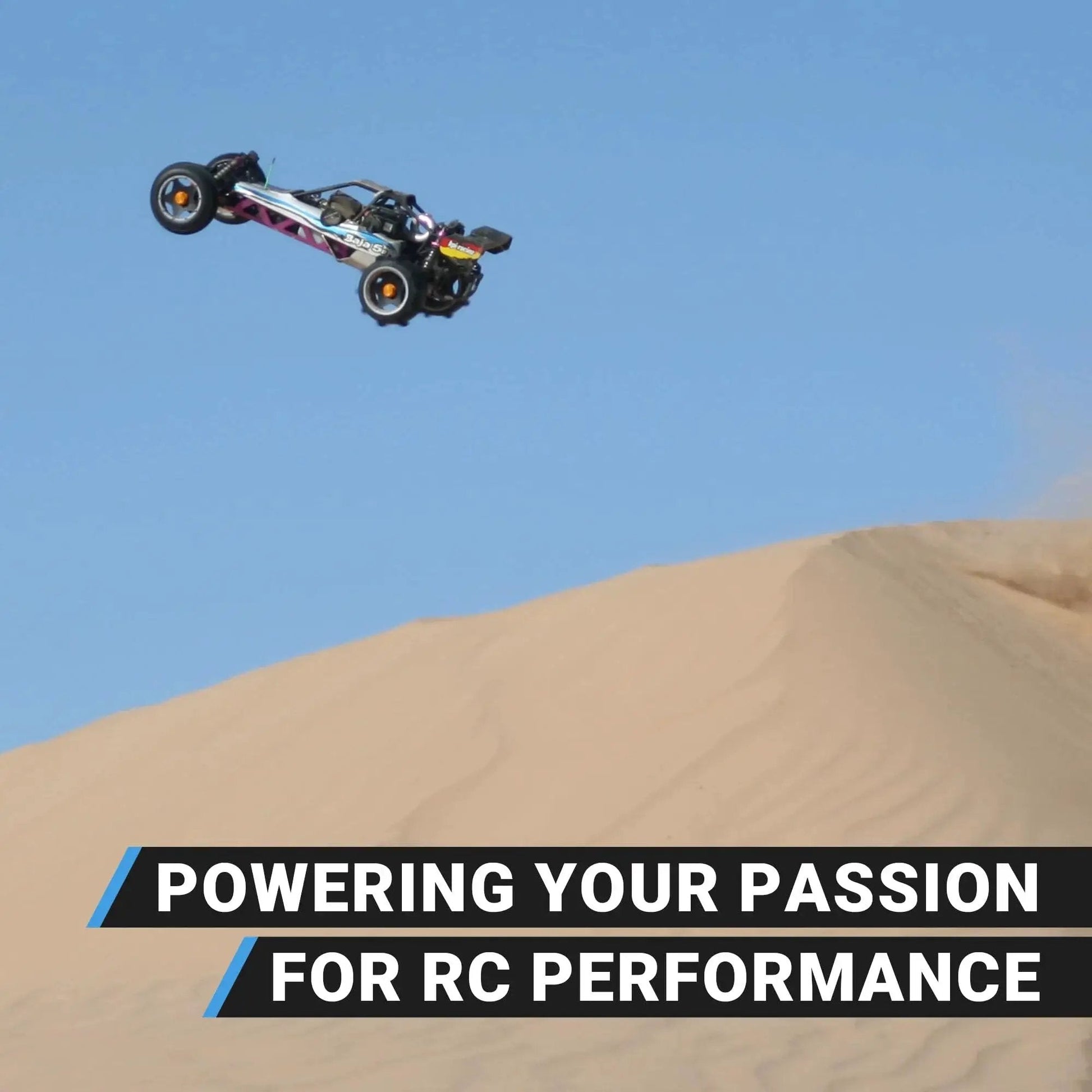 Remote control car jumping over sand dunes in desert terrain, showcasing power and performance against clear sky.