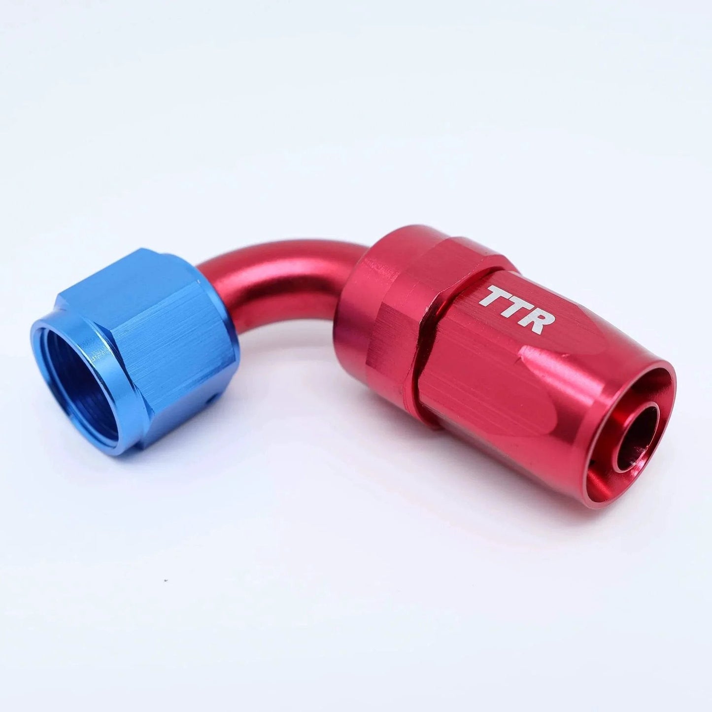 Close-up of red and blue swivel fitting from Three Eighth Inch Stainless Steel Braided Fuel Line Hose E85 Compatible Kit