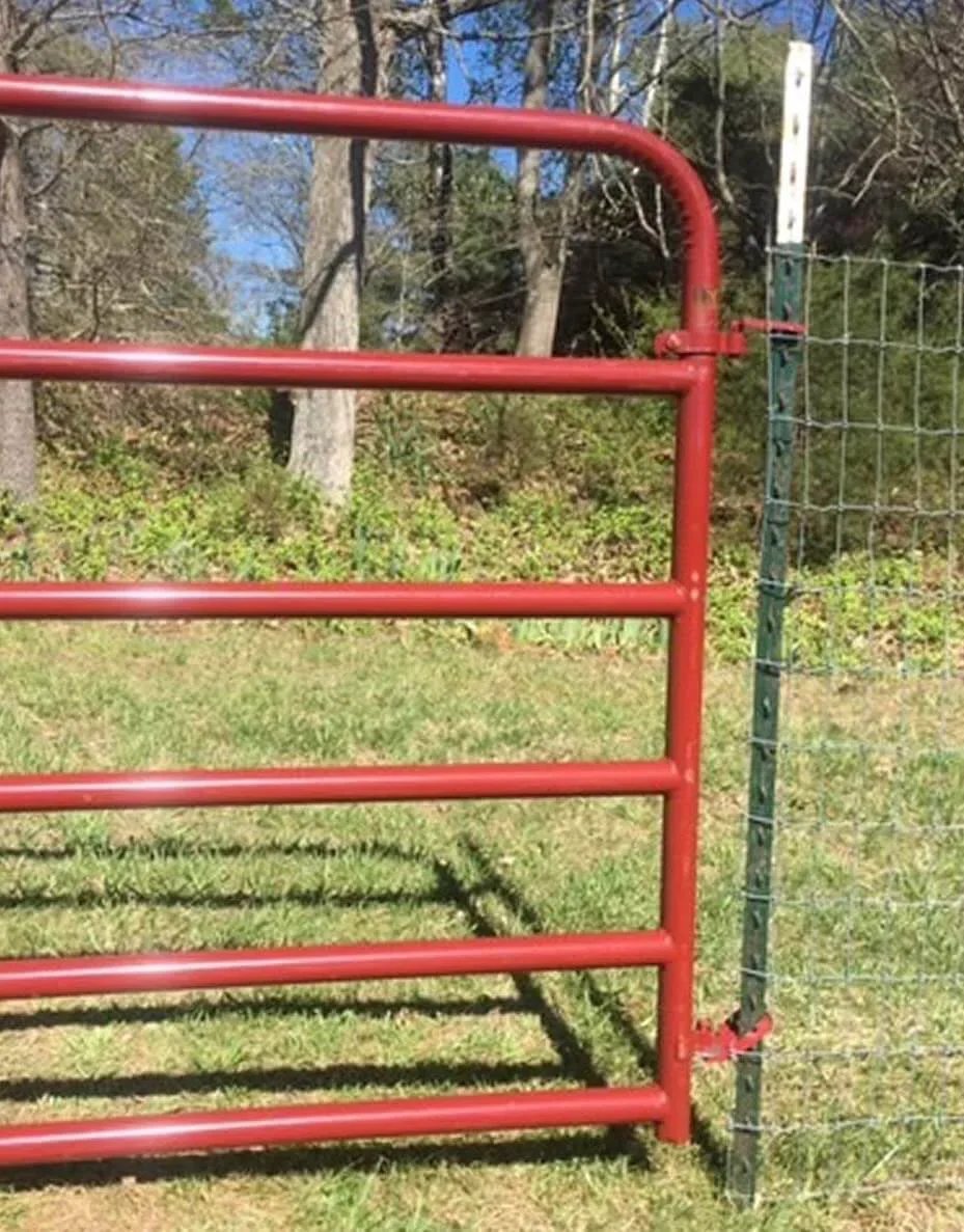 Farm gate attached with Patented T Post Hinge Pins For Easy Gate Hanging From Metal T Posts Made In USA Fully Patented Hardware