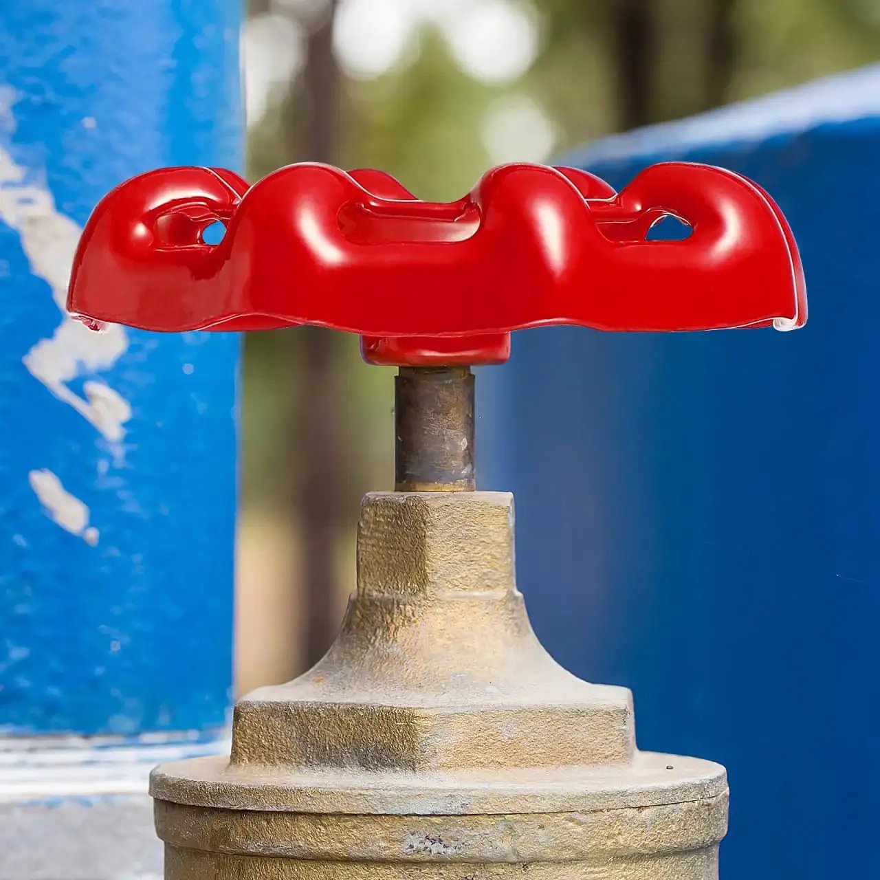 Red cast iron faucet handle installed on outdoor valve for easy operation, part of 10 Pack Metal Outside Faucet Round Wheel Handles With Square Broach For Cast Iron Hose Bibb Valves Replacement And Shutoff Valve Easy Operation Durable Cast Iron Construction Reliable Sealing Ideal For Garden And Plumbing Fixtures