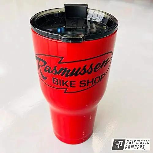 Red tumbler with logo, coated with Astatic Red Solid Tone Polyester Powder Coating 1 LB High Gloss Finish For Automotive Metal Wheels And Parts Durable High Performance Coating Proudly Made In The USA 85 Plus Gloss Units