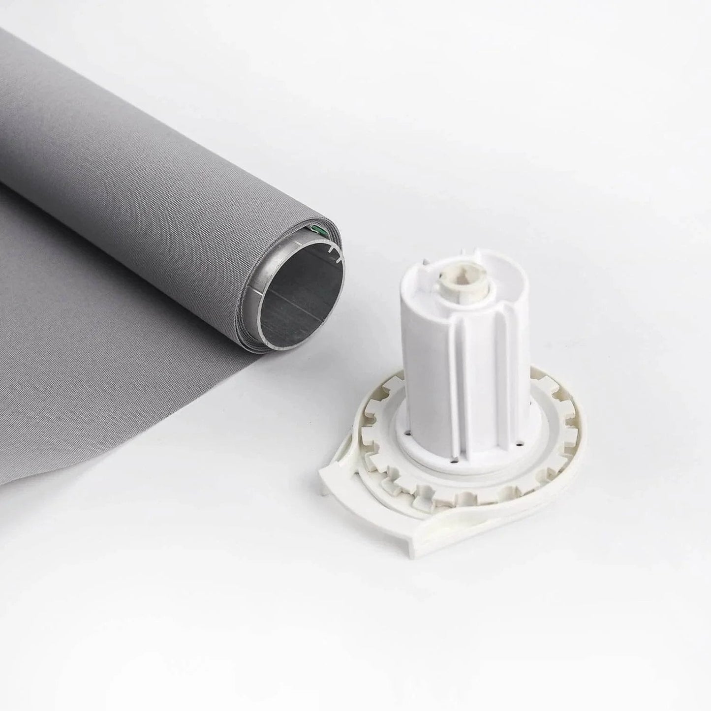 R16 Roller Shade Clutch for 1.5" Tube Roller Shade Brackets & Hardware shown with grey rolled fabric and white clutch