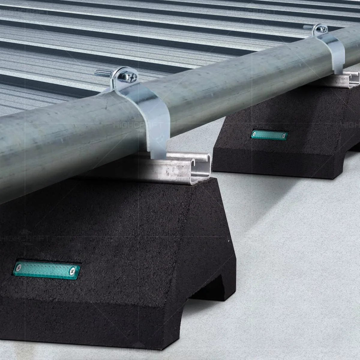 Rooftop Pipe Support Block Highcraft Heavy Duty With Galvanized Steel Strut For Piping Conduit And HVAC Mounts On Flat Roofs 750 Lb Capacity 5-3/4 In By 10 In Black Recycled Rubber Sleeper Curb Replacement installed on a flat roof with galvanized pipe.