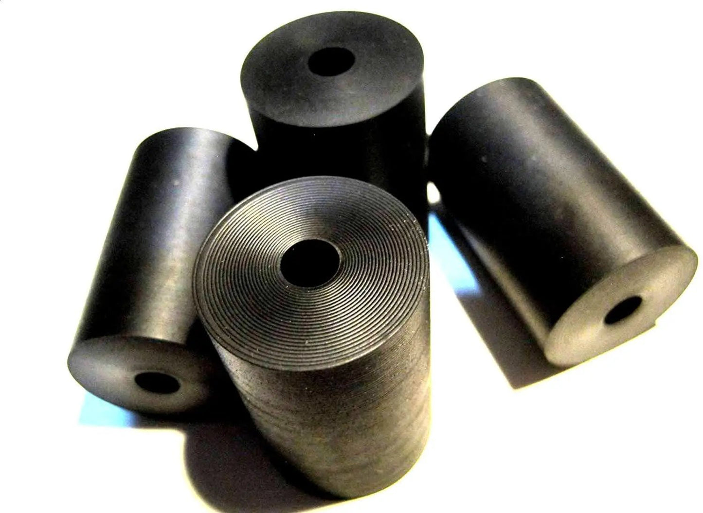 Premium Four Pack Rubber Spacer Set Made In USA For Home Industrial Automotive Marine Use Durable Anti Vibration Spacers One Inch Outer Diameter One Quarter Inch Inner Diameter One And A Half Inch Thick Izzy USA LLC displayed