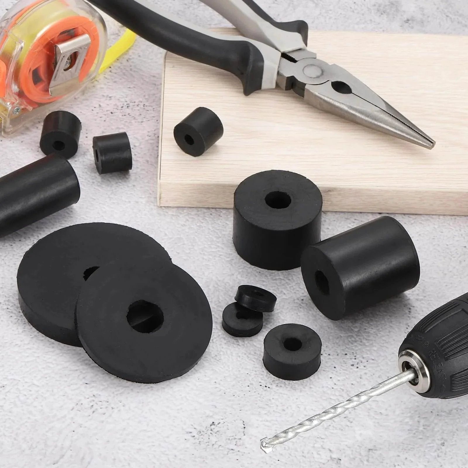 12 Pcs Thick Rubber Spacers Five Eighths Inch Outer Diameter One Quarter Inch Inner Diameter One Half Inch Thickness Rubber Bushings Anti Vibration Flat Spacer Washers For Home And Industrial Machinery And Equipment, shown with tools and wood surface.