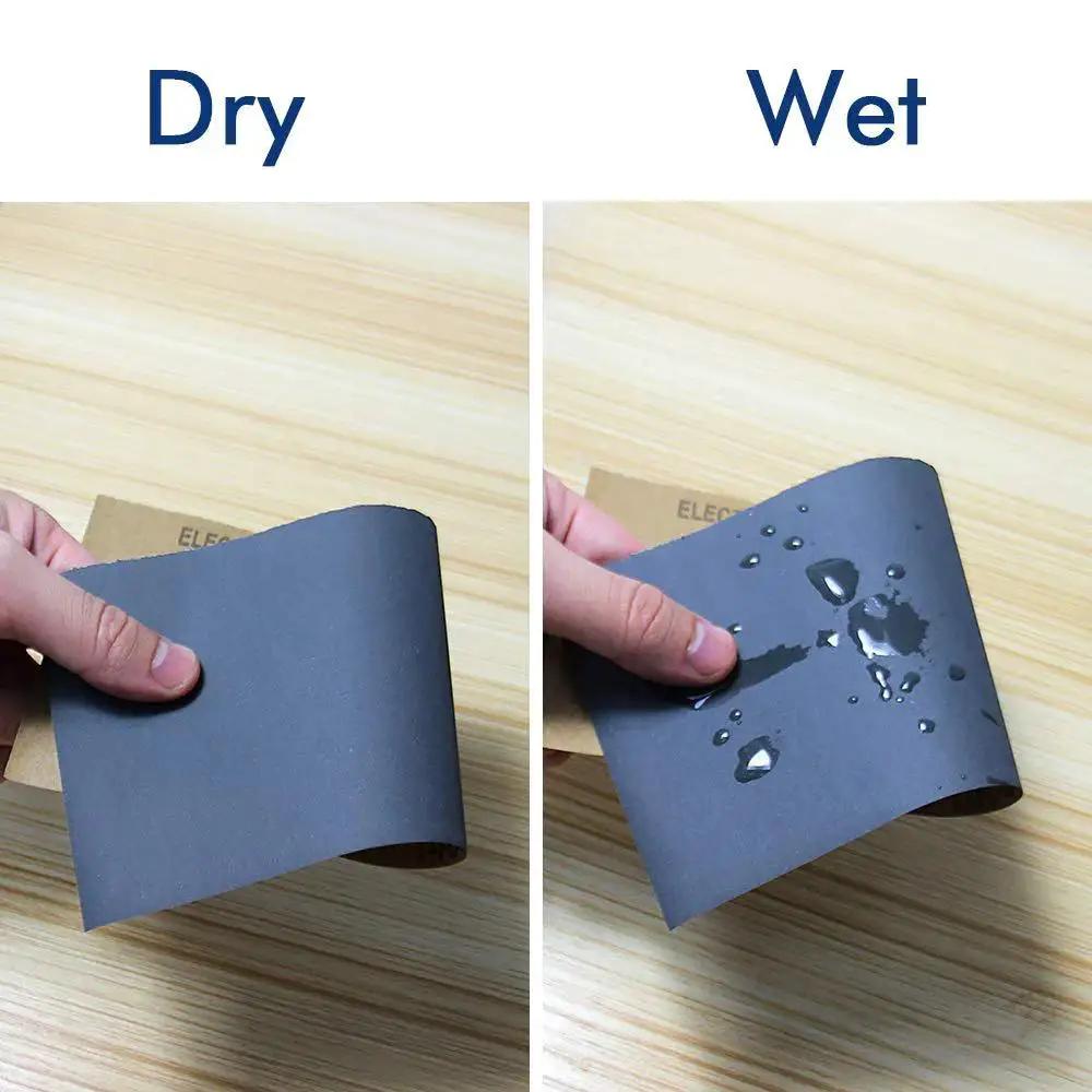 24 Sheet Sandpaper Variety Pack 120 To 3000 Grits With Hand Sander 9x3.6 Inch demonstrating dry and wet sanding on wood surface.