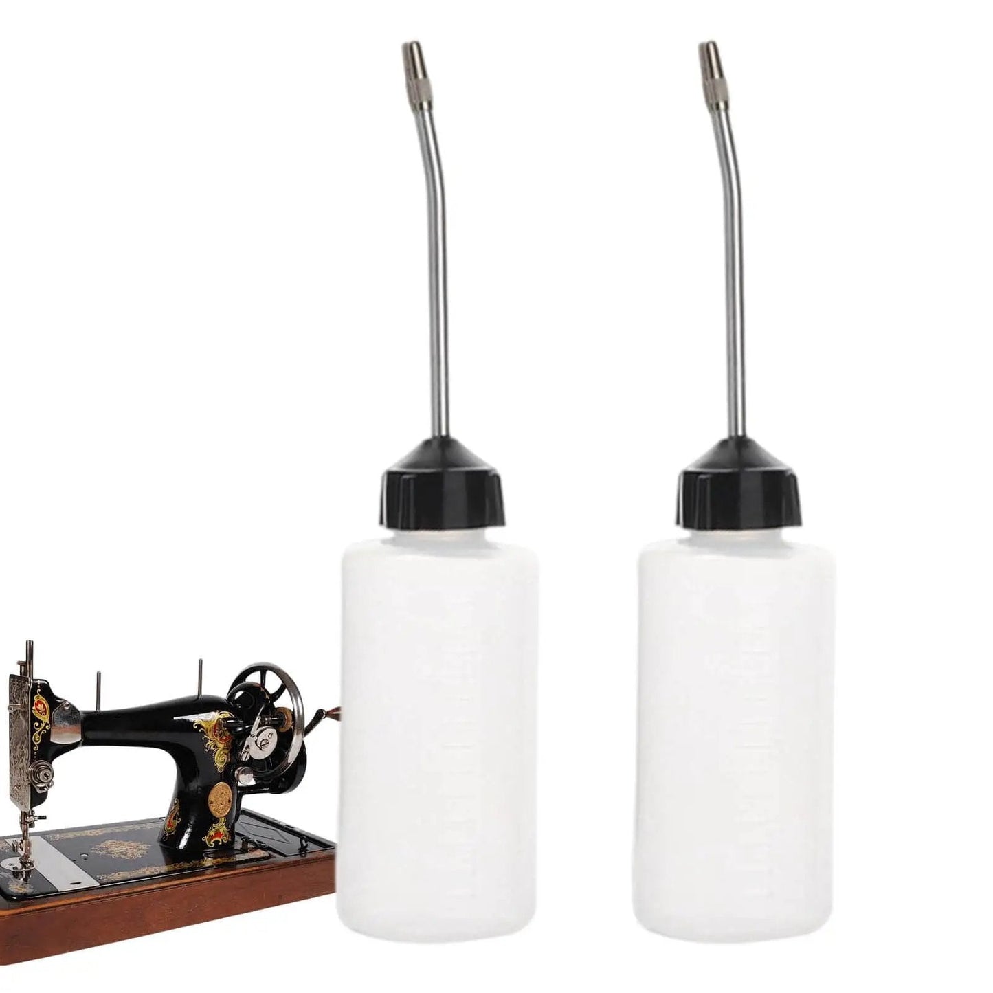 Two Pack 120ml Sewing Machine Oil Can Set With Precision Long Nozzle Lubricant Dispenser next to sewing machine
