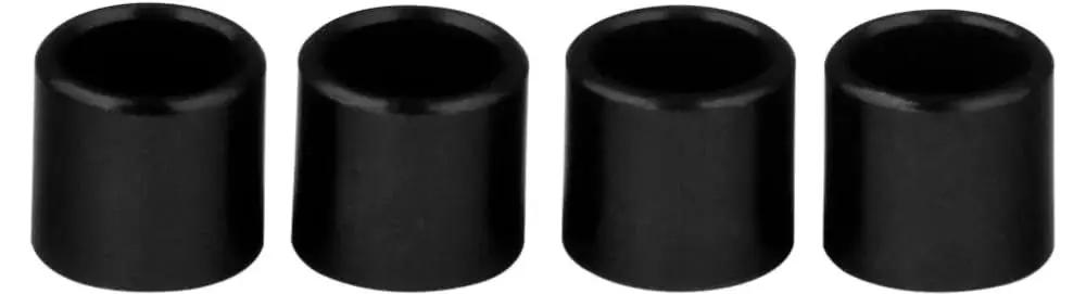 Set of 4 black bearing spacers for skateboard and longboard, designed for precise wheel alignment and smooth rolling across trucks and bearings.