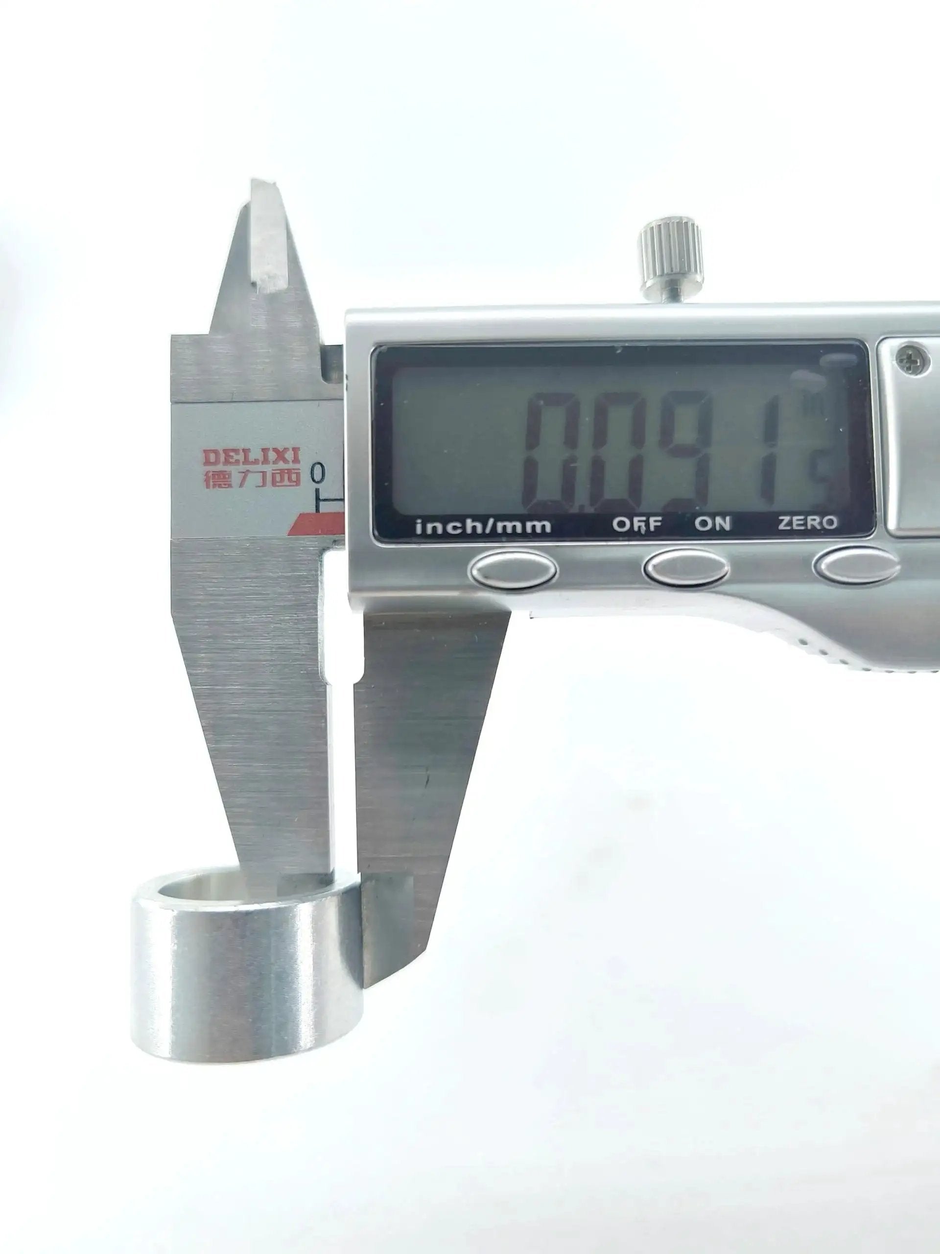 Close-up of Replacement Sleeve Bearings 42-40-0580 for Bandsaws with digital caliper showing diameter measurement.
