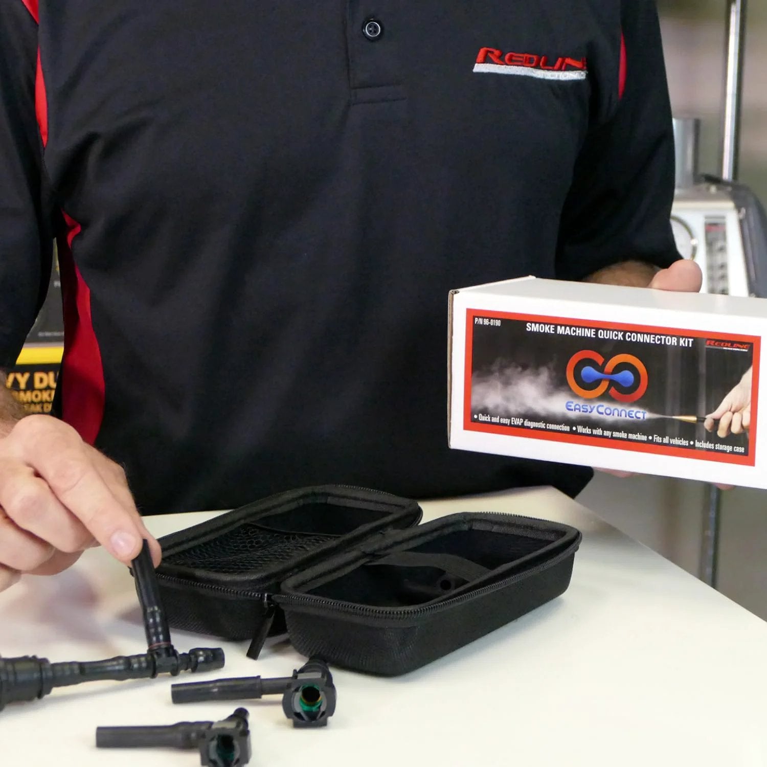 Universal EVAP System Leak Detection Kit That Connects To Any Automotive Smoke Machine For Quick And Easy EVAP Leak Finding With Flexible Tee Adapters And Vacuum Hoses Soft Case And Redline Detection EasyConnect 96-0190 displayed with quick connectors and black soft case.
