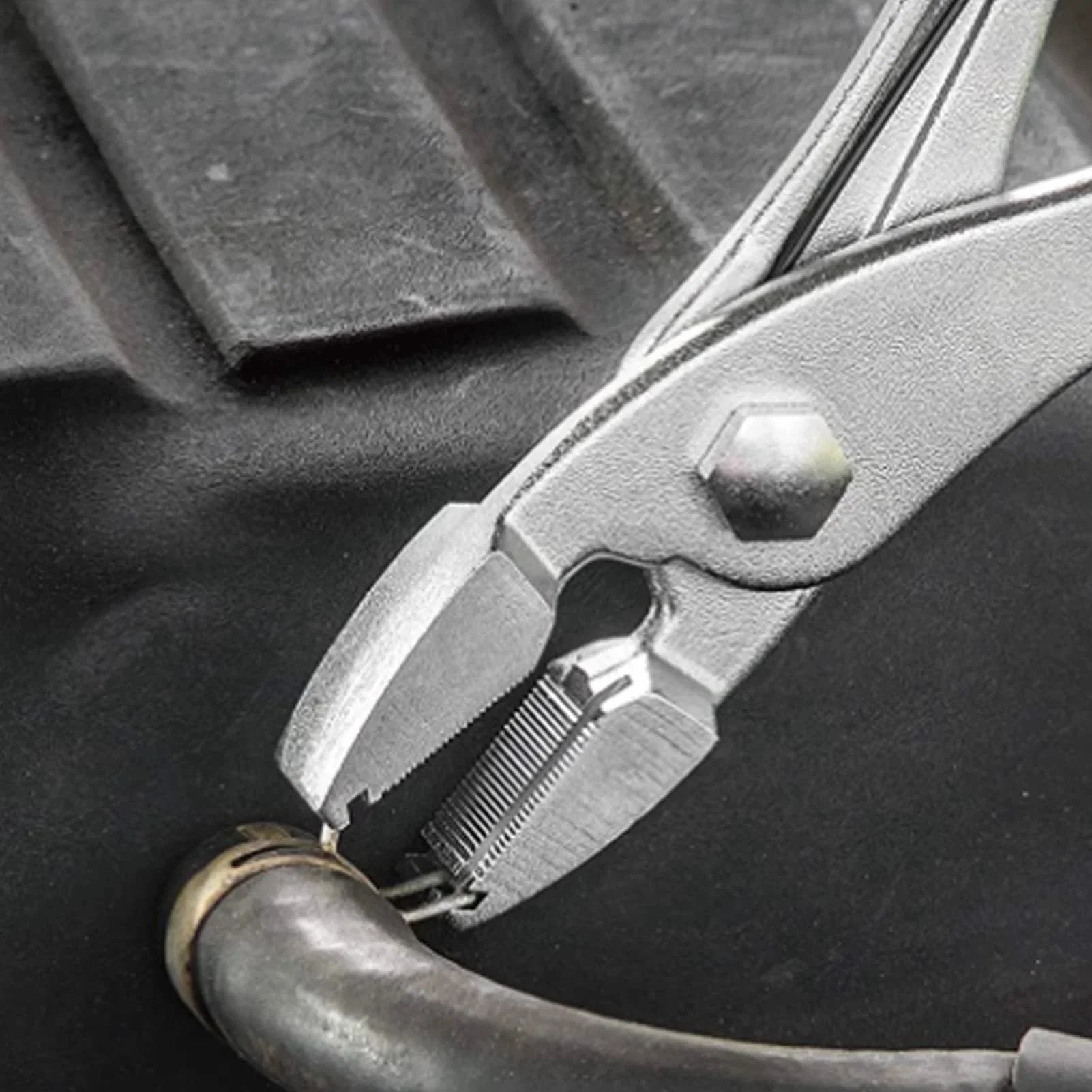 Spring Clamp Pliers Universal Radiator Hose Clamp Pliers 0.6 Inch Multi Directional Hose Clamp Pliers gripping a hose
