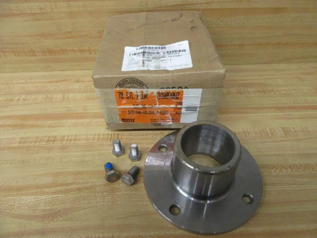 Beefy Industrial Grade Stainless Steel Bushing Holder For Heavy Duty Machinery With Three Inch Height Inner Diameter Two And Three Quarter Inches Outer Diameter Seven Inches Size Seventy Rexnord 4310070HZ placed on table with packaging and bolts