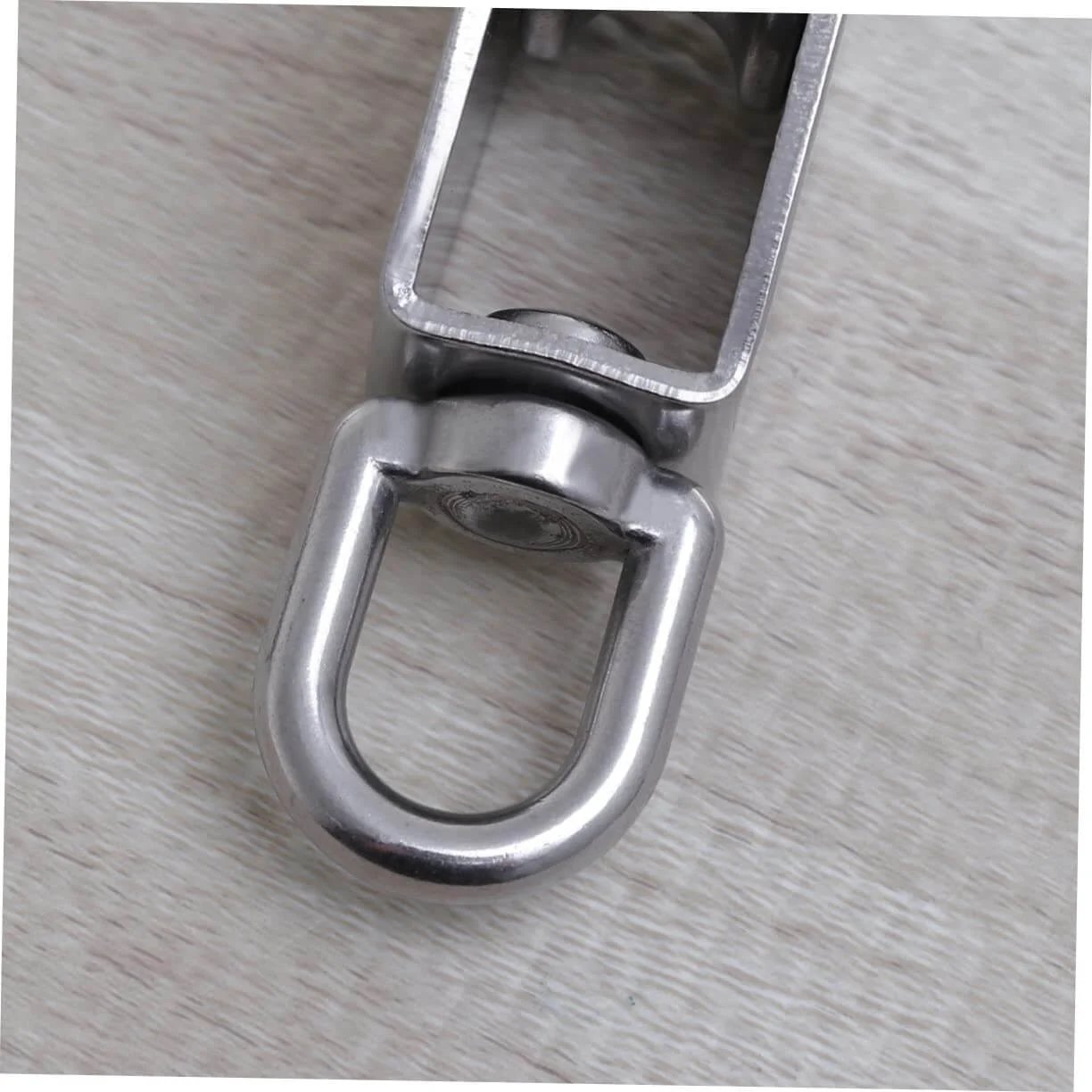 Close-up of a 32mm stainless steel single-sheaved pulley roller with swivel function, heavy-duty wire rope pulley for lifting systems.