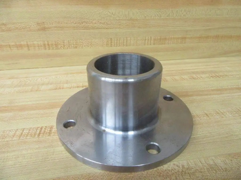 Beefy Industrial Grade Stainless Steel Bushing Holder For Heavy Duty Machinery With Three Inch Height Inner Diameter Two And Three Quarter Inches Outer Diameter Seven Inches Size Seventy Rexnord 4310070HZ