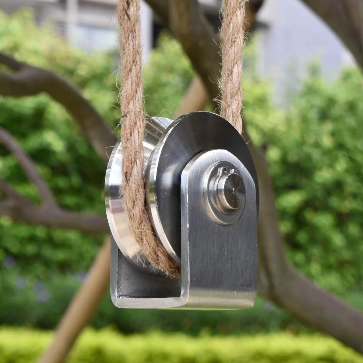 Grooved Wheel Pulley Block Pulley Wheel Stainless Duplex Bearing in outdoor setup with rope for lifting and handling use.